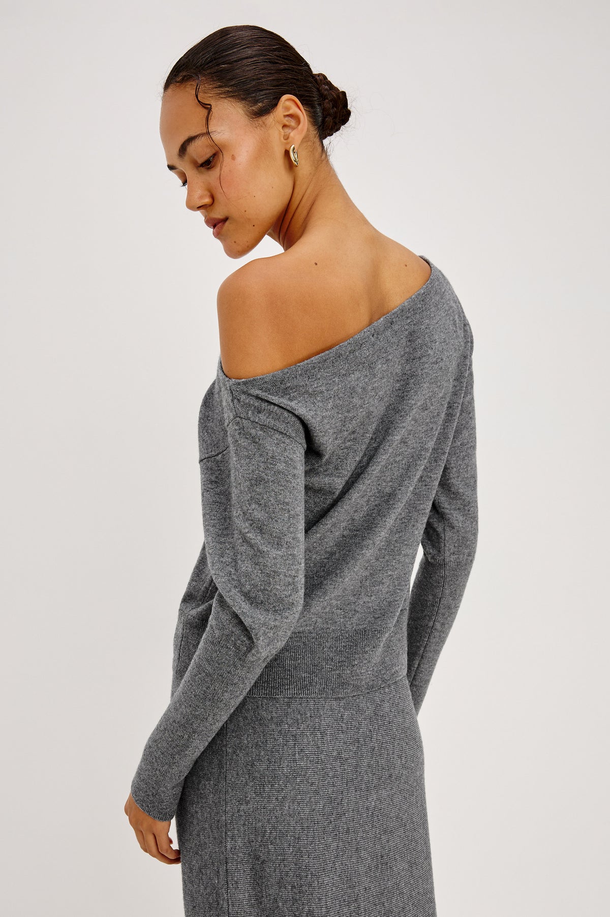 Tianna Sweater in Wool Blend With Off-Shoulder Neckline and Long Sleeves in Heather Charcoal Colorway - Back Crop View Featured on Model.