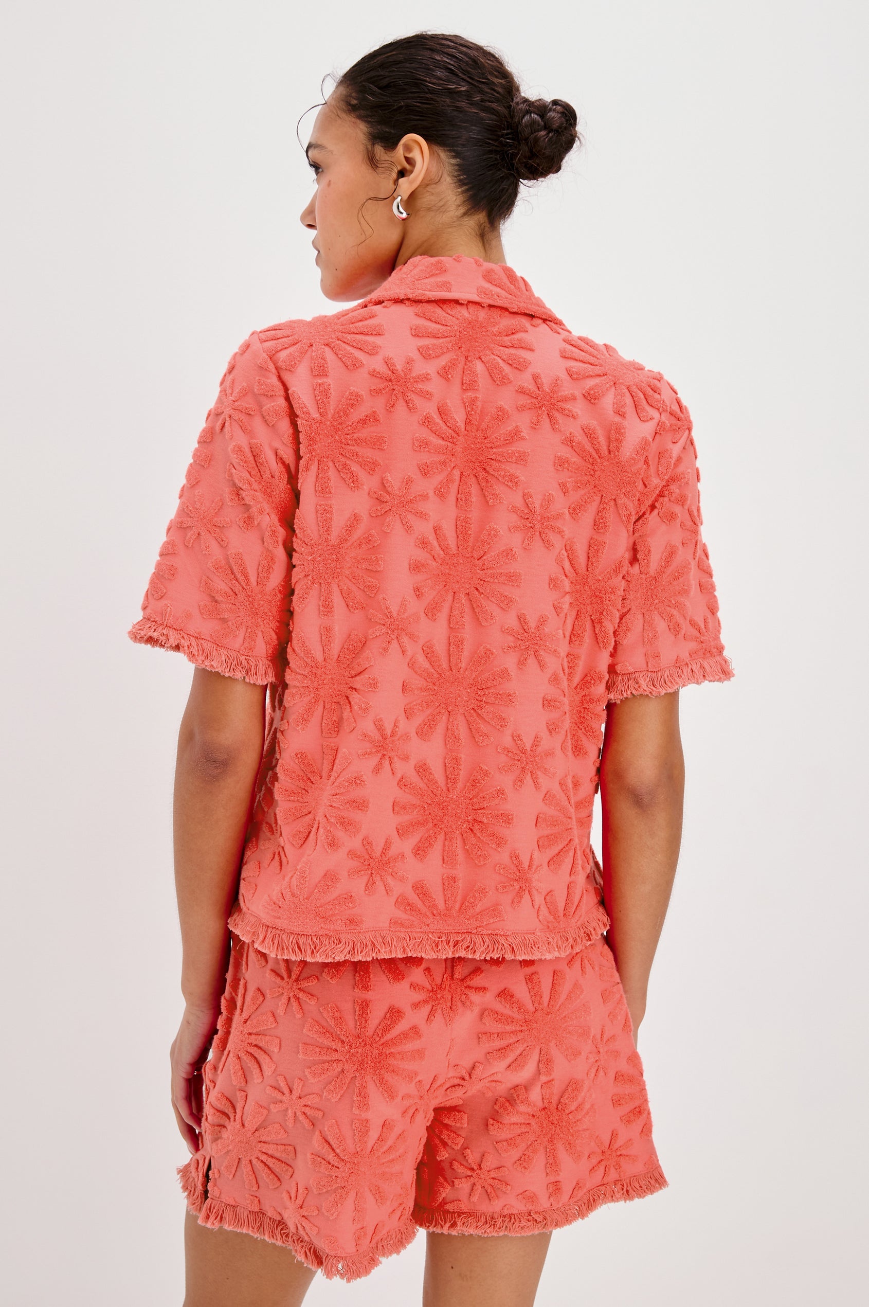 Tiff V-Neck Button Front Shirt with Short Sleeves and Fringed Hems in Red Sunburst Jacquard Colorway. Back View Shown on Model.