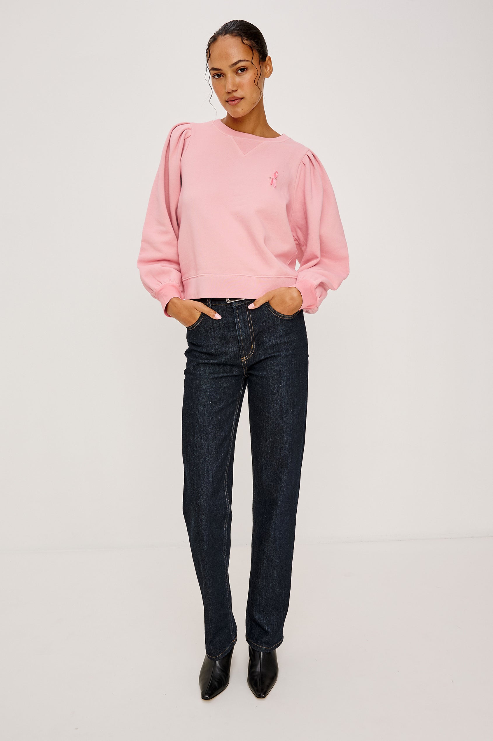 Tiffany Long-Sleeve Sweatshirt with a Crew Neck and Deep Pleated Sleeves in Faded Brave Pink Colorway for Breast Cancer Awareness - Full Body Front View Featured on Model