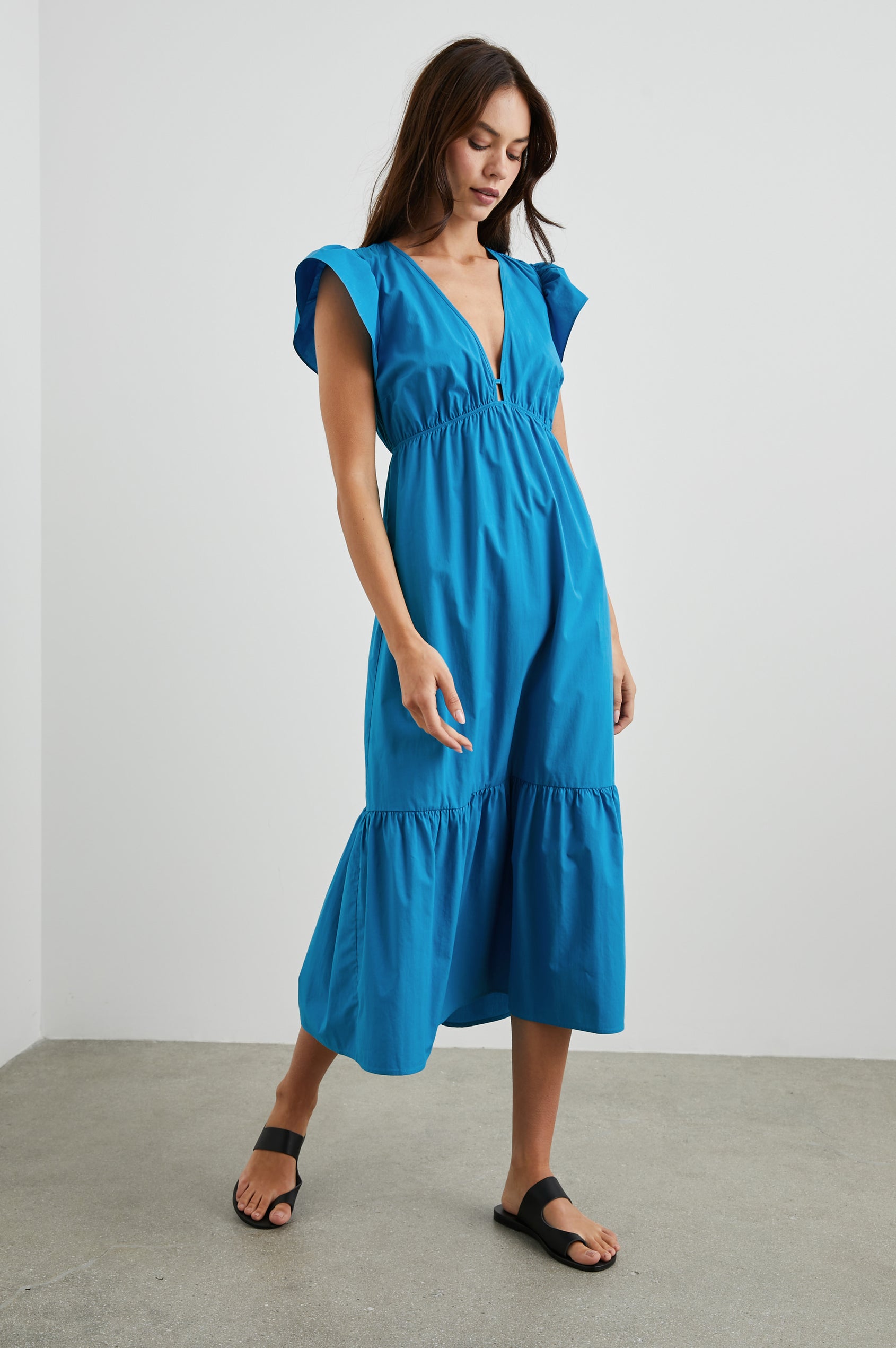 Tina Short Sleeve Midi Dress with Flutter Sleeves, a Deep V Neck with a Cutout and a Tiered Skirt in Turkish Tile Colorway, a Blue - Front Full Body View Featured on Model 