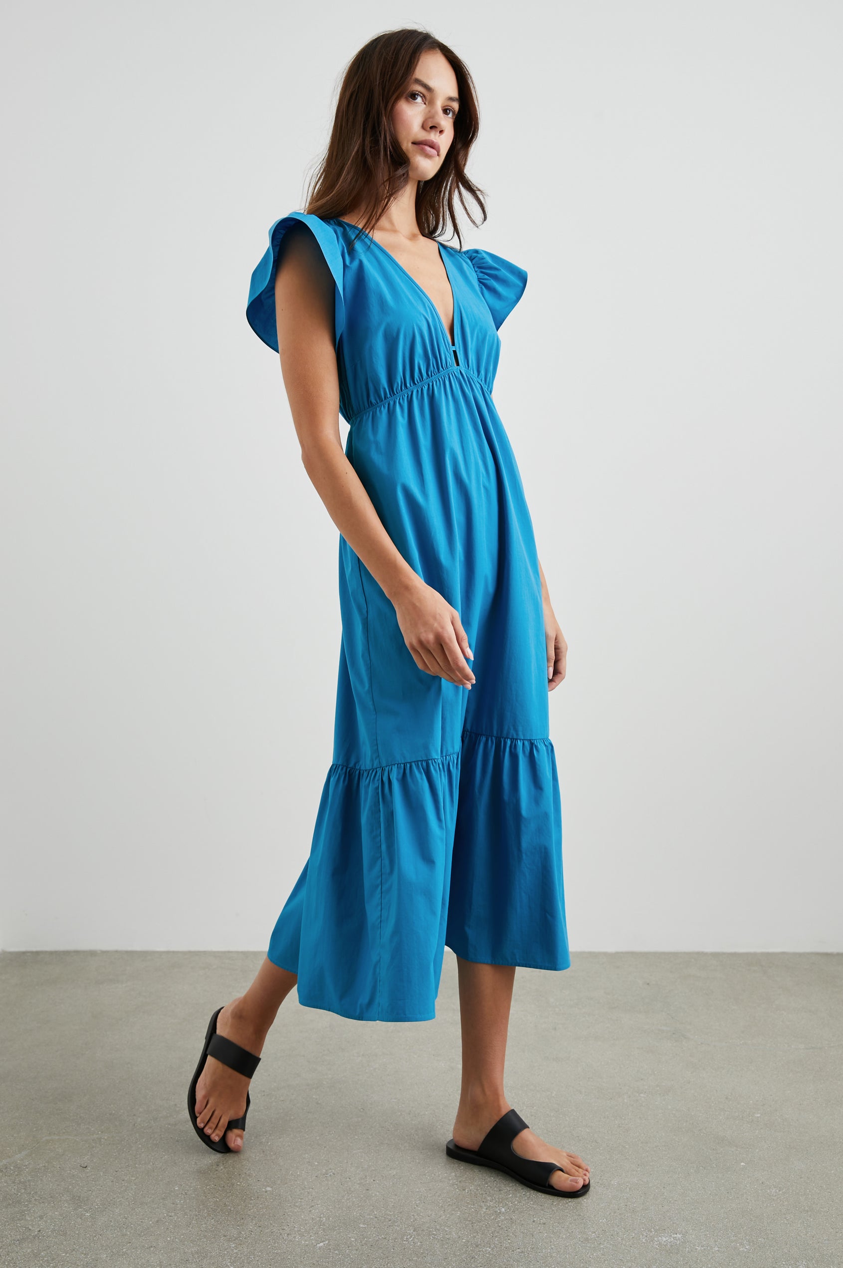 Tina Short Sleeve Midi Dress with Flutter Sleeves, a Deep V Neck with a Cutout and a Tiered Skirt in Turkish Tile Colorway, a Blue - Front Full Body View Featured on Model 