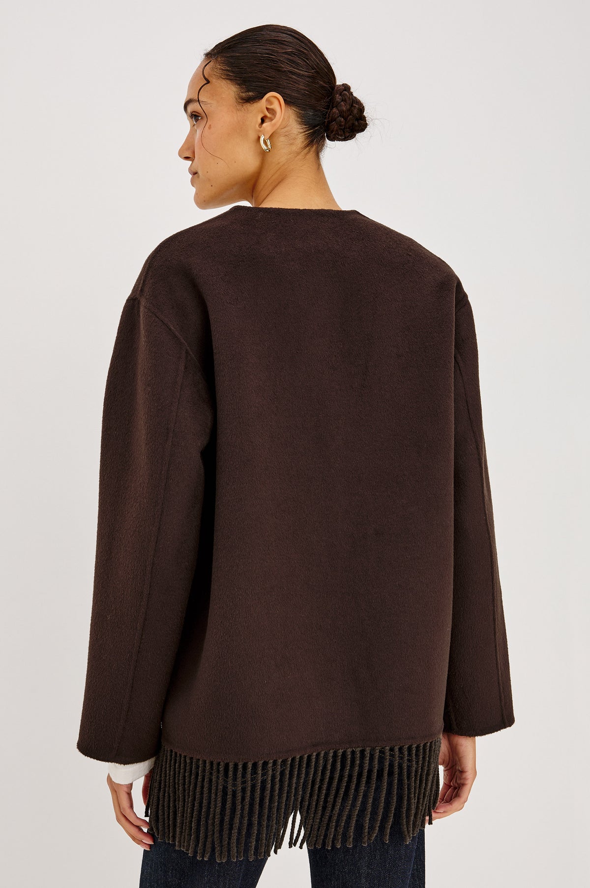 Tomoko Jacket in Heavy Wool Blend With Collarless Neckline, Front Buttons, Front Patch Pockets, and Fringe Hem in Chocolate Colorway - Back Crop View Featured on Model.