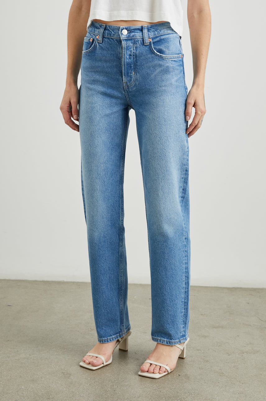 Topanga Straight Jeans with Belt Loops, Two Front Pockets plus a Coin Pocket and Two Back Patch Pockets in Baja Blue Colorway - Front View Featured on Model