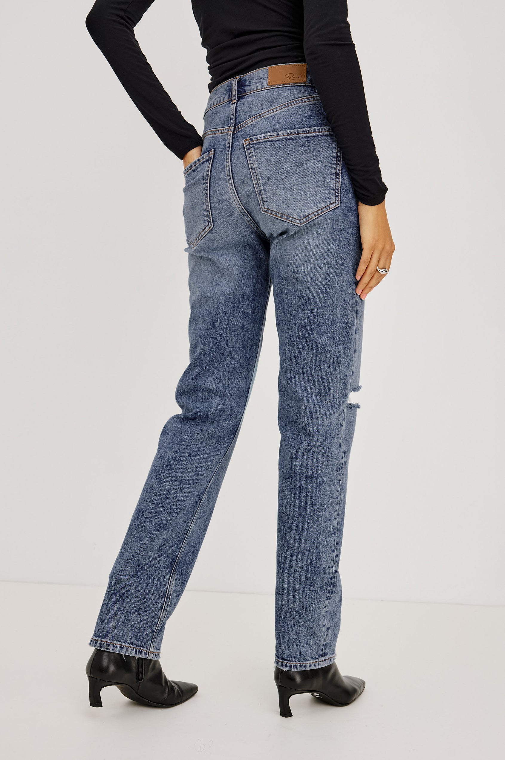 Topanga Straight Jean in Comfort-Stretch Denim With High-Rise, Distressed Knee, 5-Pockets, and Zipper Fly in Rancher Deconstructed Colorway - Lower Body Back View Featured on Model