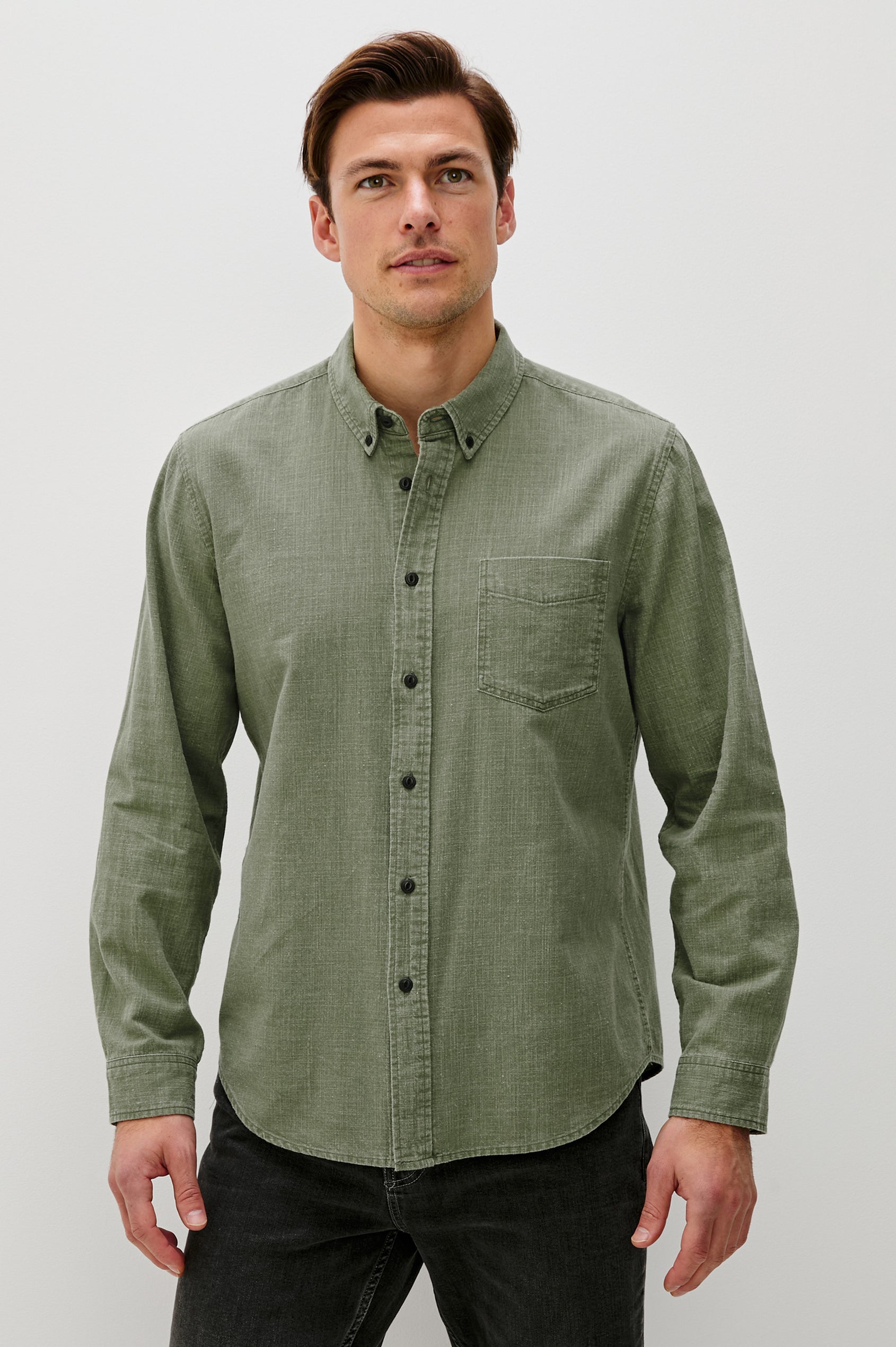 Tristan Long-Sleeve Button Down with a Chest Patch Pocket in Surplus Colorway, a olive green  - Front View Featured on Model