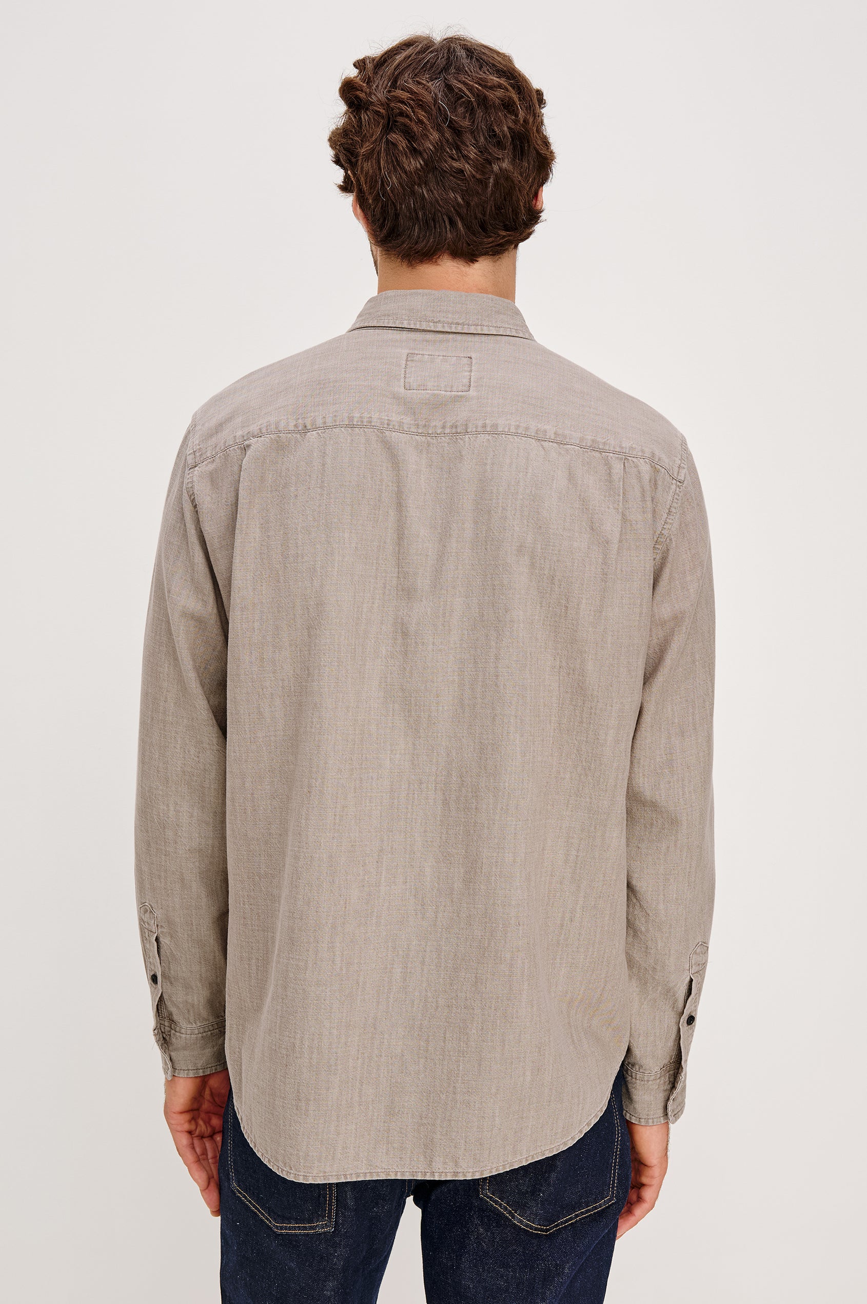 Tristan Long-Sleeve Button Down with a Chest Patch Pocket in Trail Mix Colorway, a brownish grey - Back View Featured on Seated Model