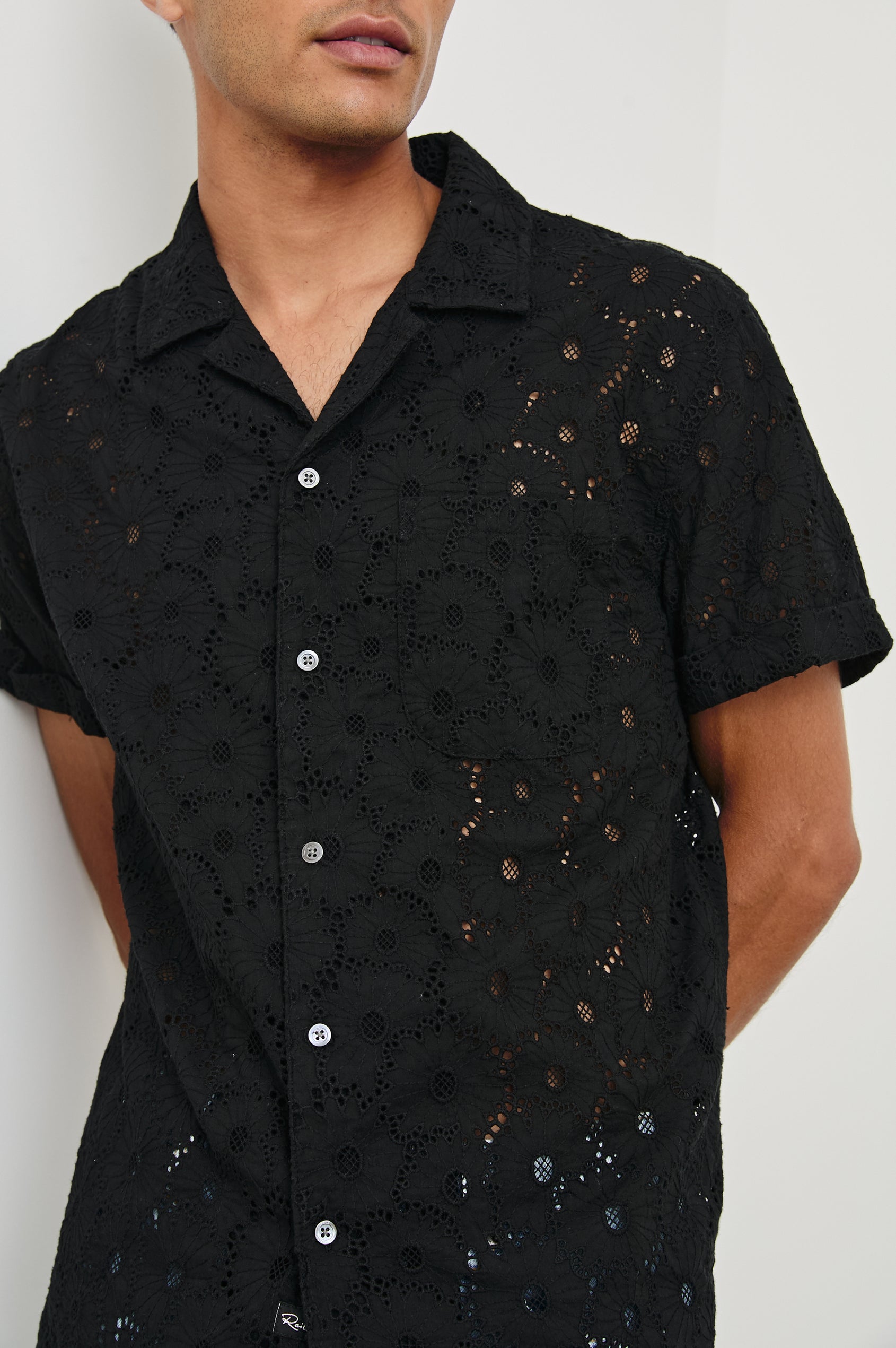 Tyler embroidered short sleeve button up with collar in Black Floral - close up of details on model