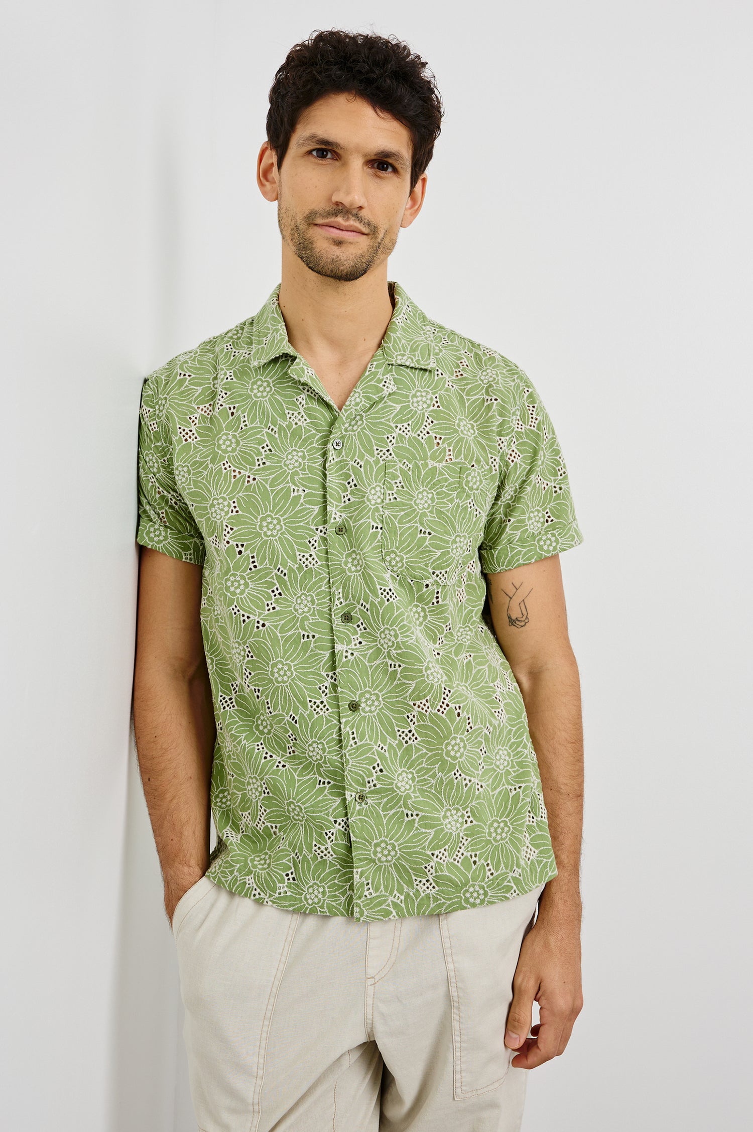 Tyler Collared Button Front Shirt with Short Sleeves and a Chest Pocket in Green White Sunflower Colorway. Front View Shown on Model.