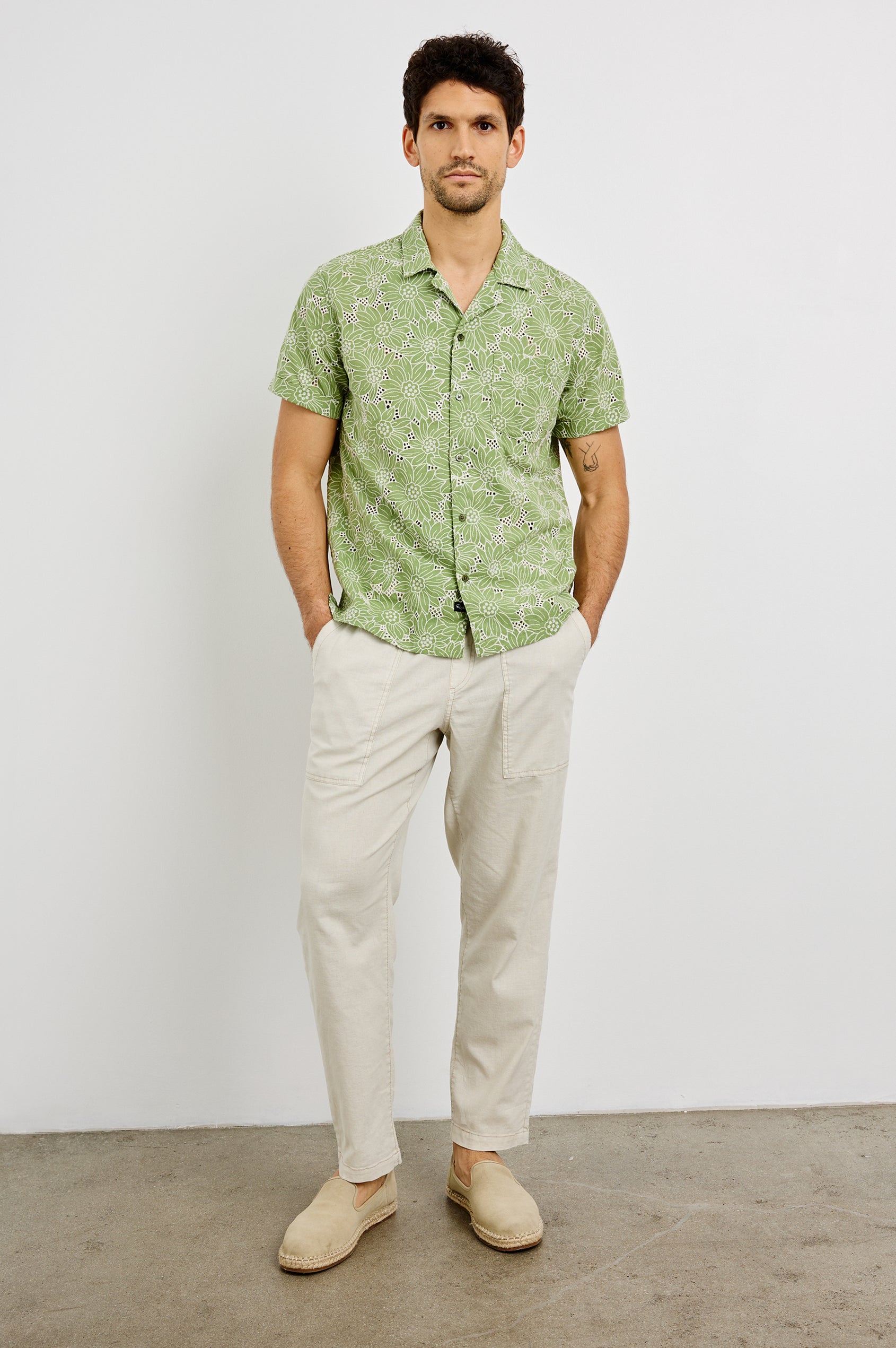 Tyler Collared Button Front Shirt with Short Sleeves and a Chest Pocket in Green White Sunflower Colorway. Front View Shown on Model.