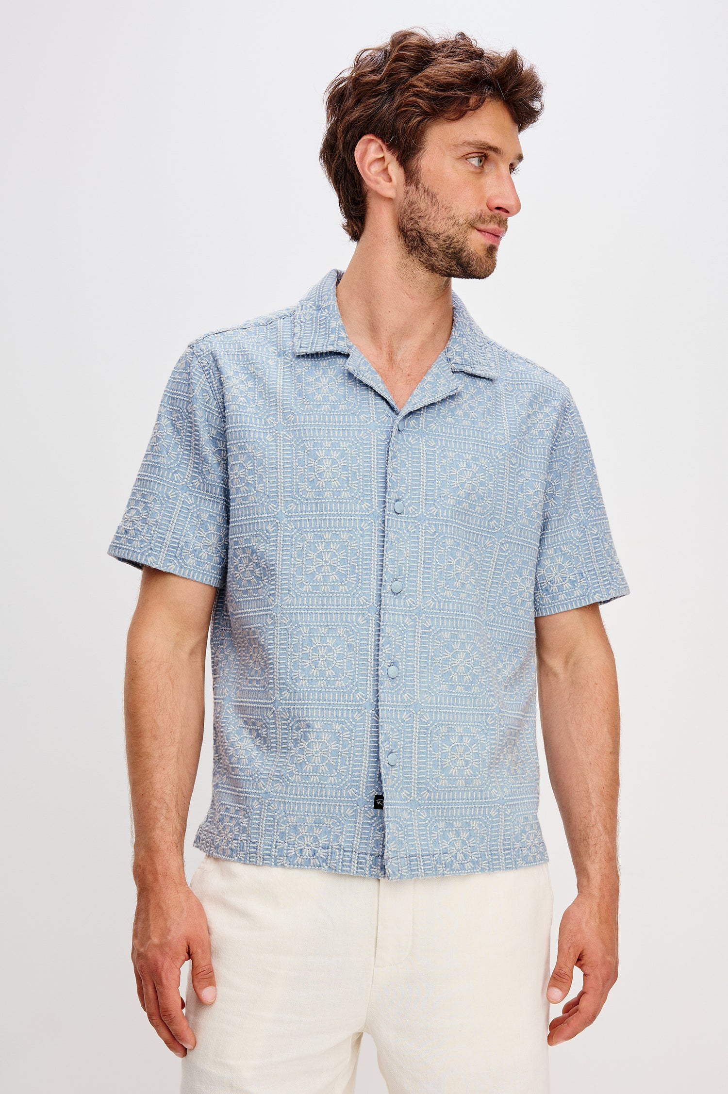 Tyler embroidered short sleeve button up with collar in Indigo Cream Squares colorway - front view featured on model