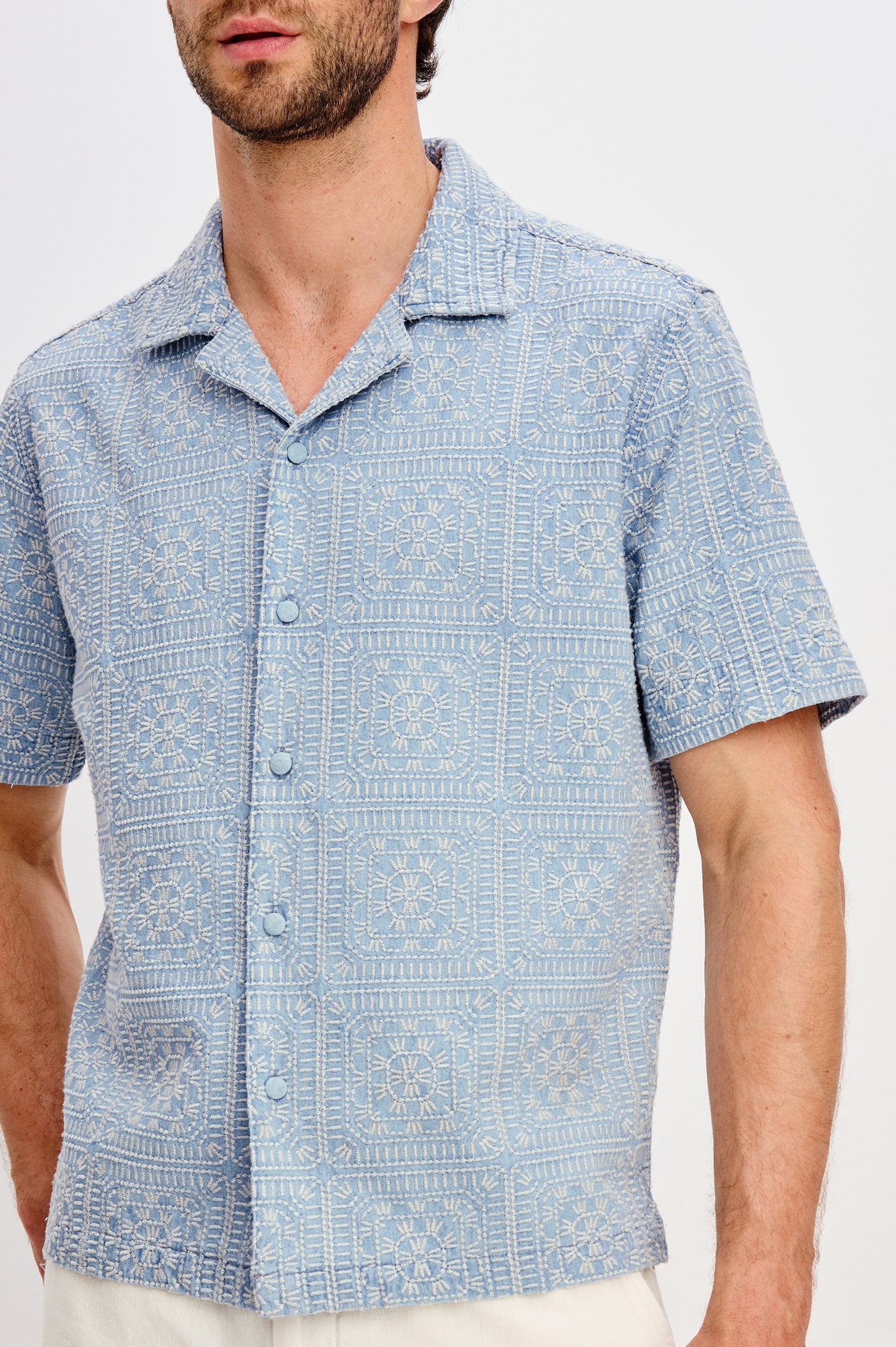 Tyler Shirt in Stretch Cotton With Floral Jute Embroidery, Front Buttons, Notched Collar, Short Sleeves, and Classic Fit in Indigo Cream Squares Colorway - Upper Body Close Up Front View Featured on Model