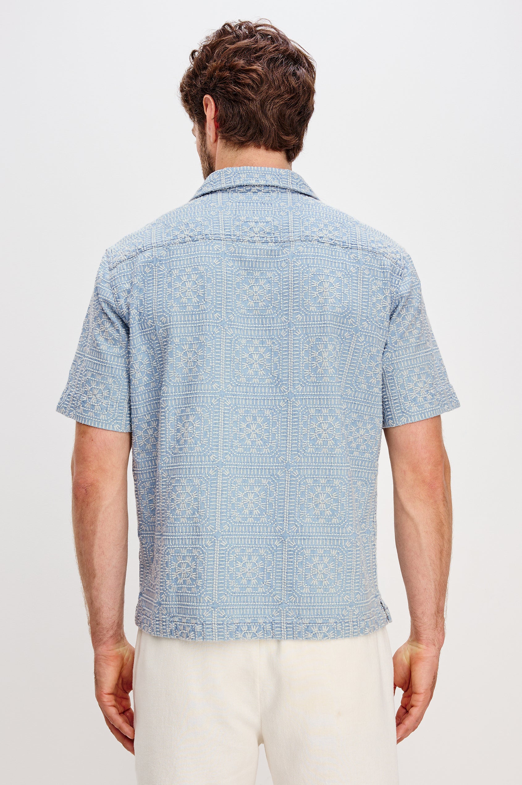 Tyler embroidered short sleeve button up with collar in Indigo Cream Squares colorway - back view featured on model