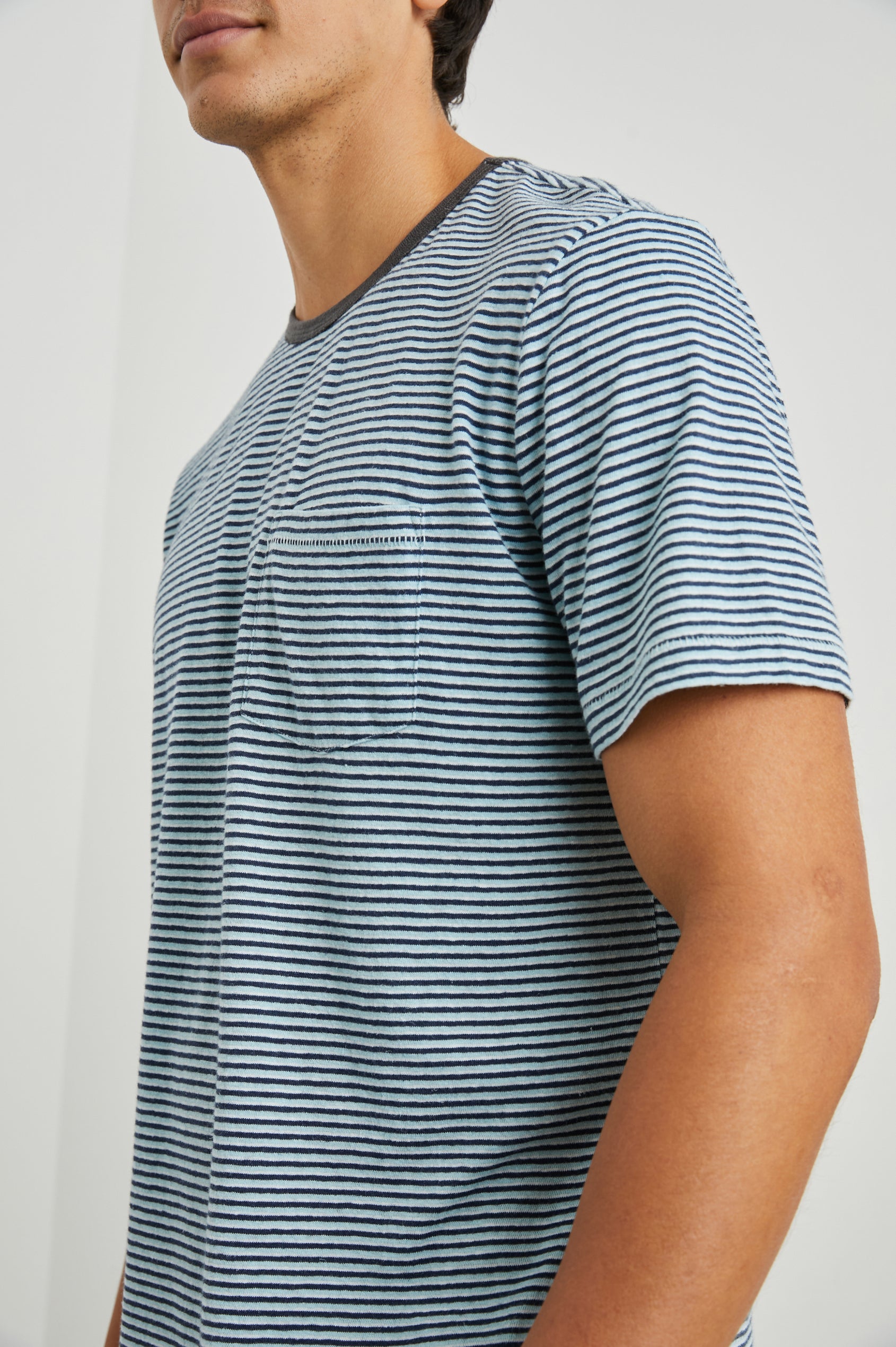 Valencia Short-Sleeve T-Shirt with a Crew Neck and a Chest Patch Pocket in Cerulean Sky Stripe Colorway, Horizontal Stripes - Side View Featured on Model  