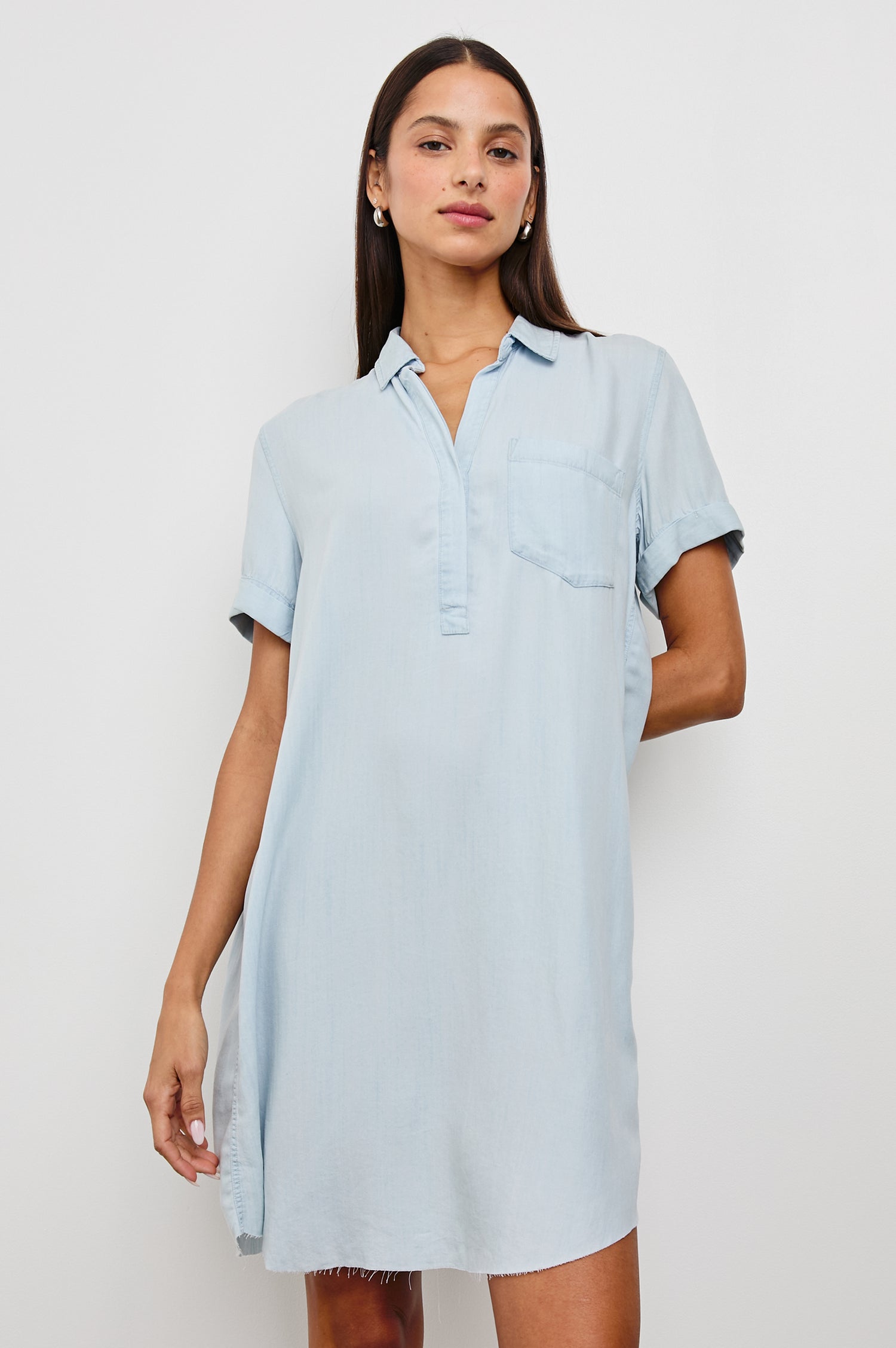 Valerie Short-Sleeve Denim Mini Dress with Rolled Cuffs, a Collar, a Half Sealed Placket, a Chest Pocket and a Raw Hem in Light Vintage Colorway - Front View Featured on Model 