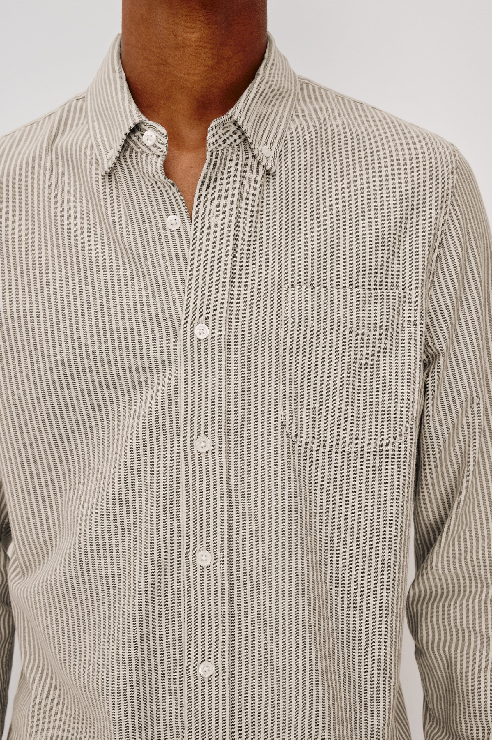 Vance button front collared shirt with long sleeves, collard stand buttons and a single chest pocket in Cedar Oat Stripe colorway. Front detail view shown on model.