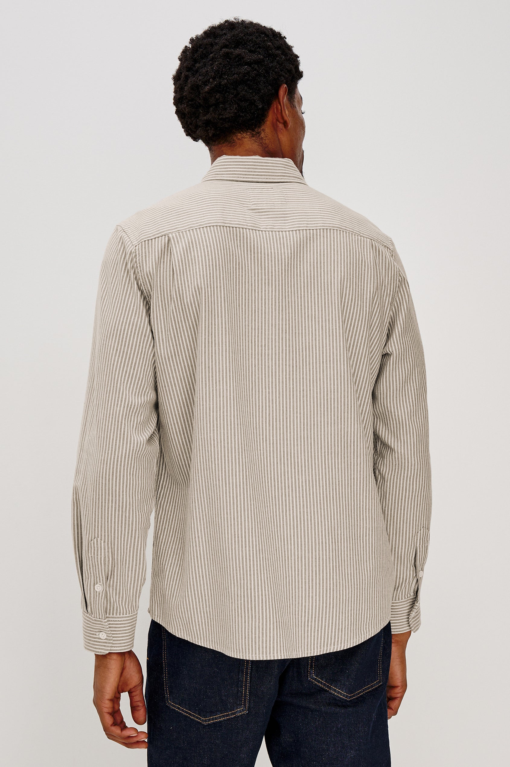 Vance button front collared shirt with long sleeves, collard stand buttons and a single chest pocket in Cedar Oat Stripe colorway. Back view shown on model.