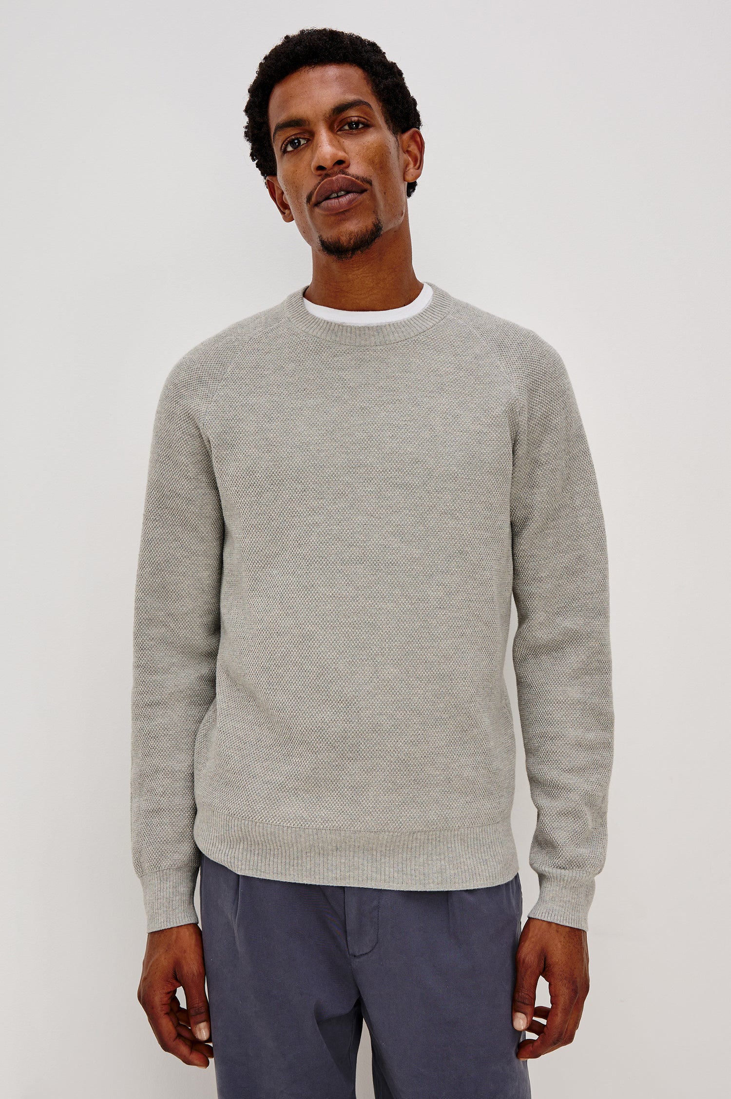 Vann long sleeve crew neck sweater in Grey Heather Colorway. Front View on Model Shown.