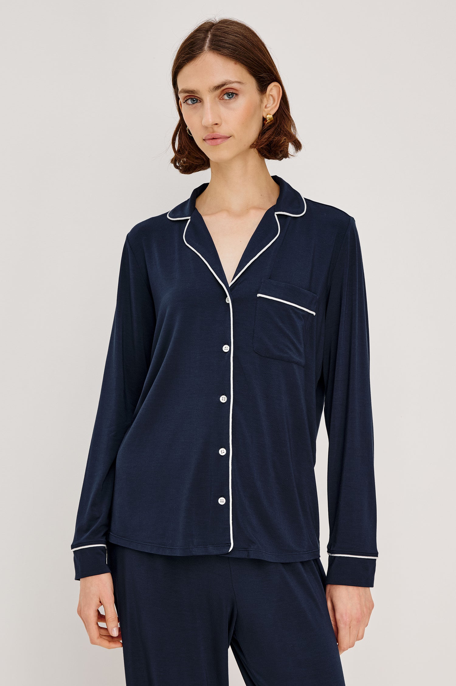 Varra Pajama Set in Jersey With Contrast Piping Button-Up Shirt With Notched Collar and Long Sleeves and Matching High-Waisted Pants With Adjustable Waist Drawstring Ties in Loose Fit in Navy Colorway - Upper Body Front View Featured on Model