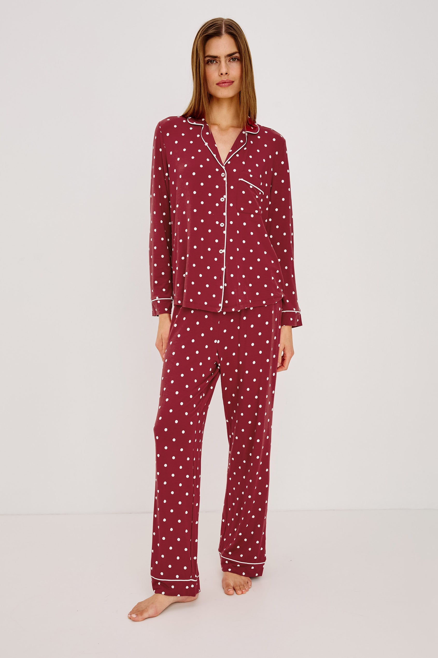 Varra Pajama Set in Soft Jersey With Contrast Piping, Relaxed Fit, Long Sleeve Collared Button-Up Shirt, and Straight-Leg Pants in Cardinal Polka Colorway - Full Body Front View Featured on Model