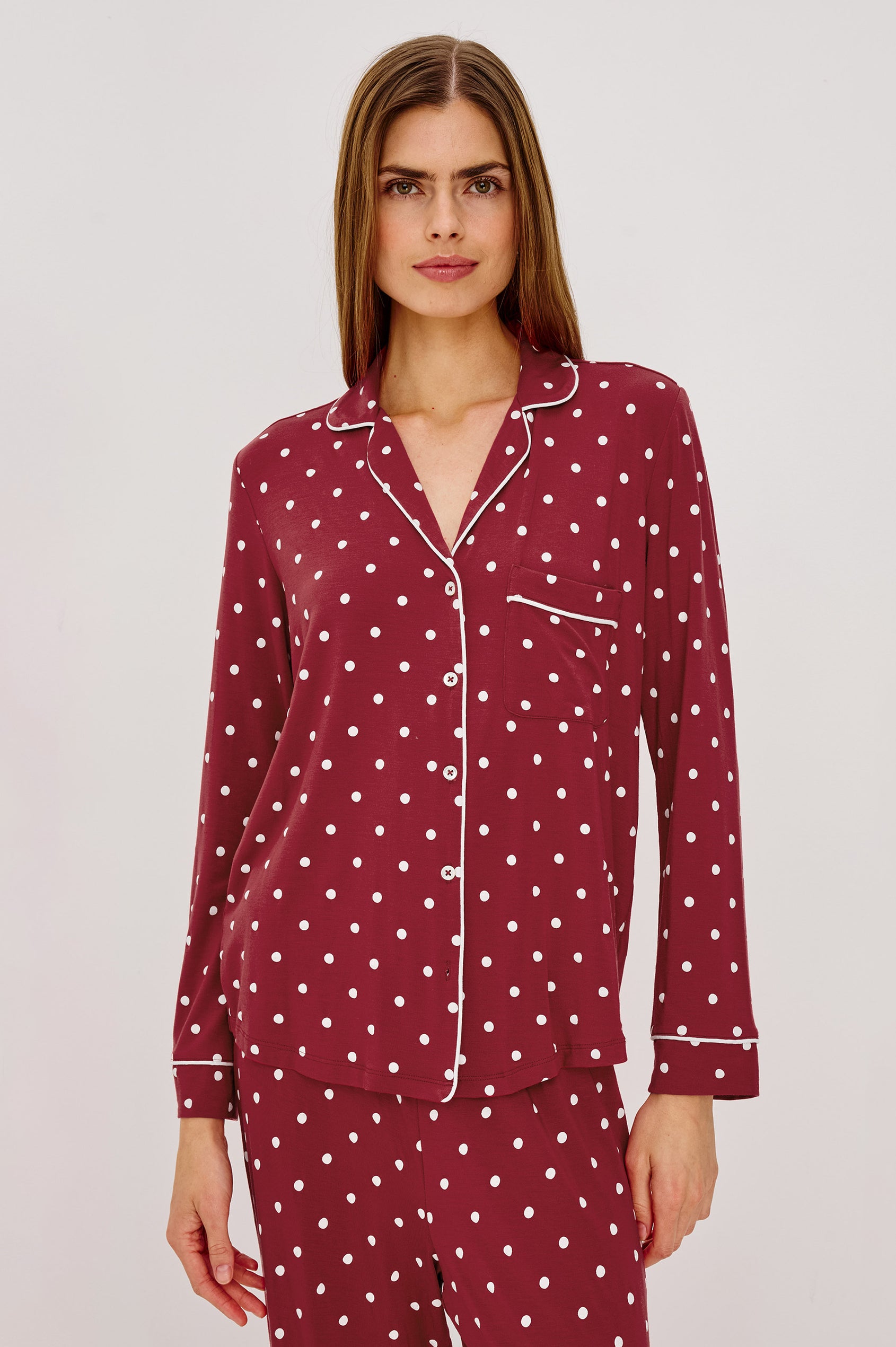 Varra Pajama Set in Soft Jersey With Contrast Piping, Relaxed Fit, Long Sleeve Collared Button-Up Shirt, and Straight-Leg Pants in Cardinal Polka Colorway - Upper Body Front View Featured on Model