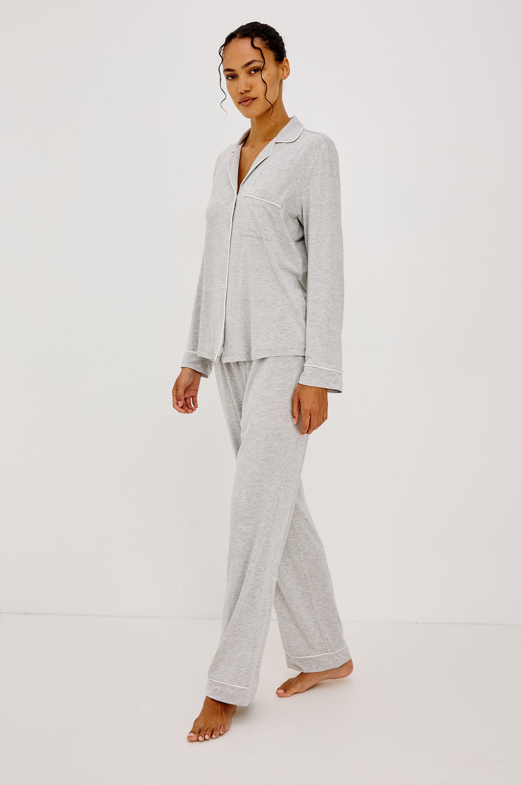 Varra Pajama Set in Soft Jersey With Contrast Piping, Relaxed Fit, Long Sleeve Collared Button-Up Shirt, and Straight-Leg Pants in Heather Grey Colorway - Full Body Side View Featured on Model