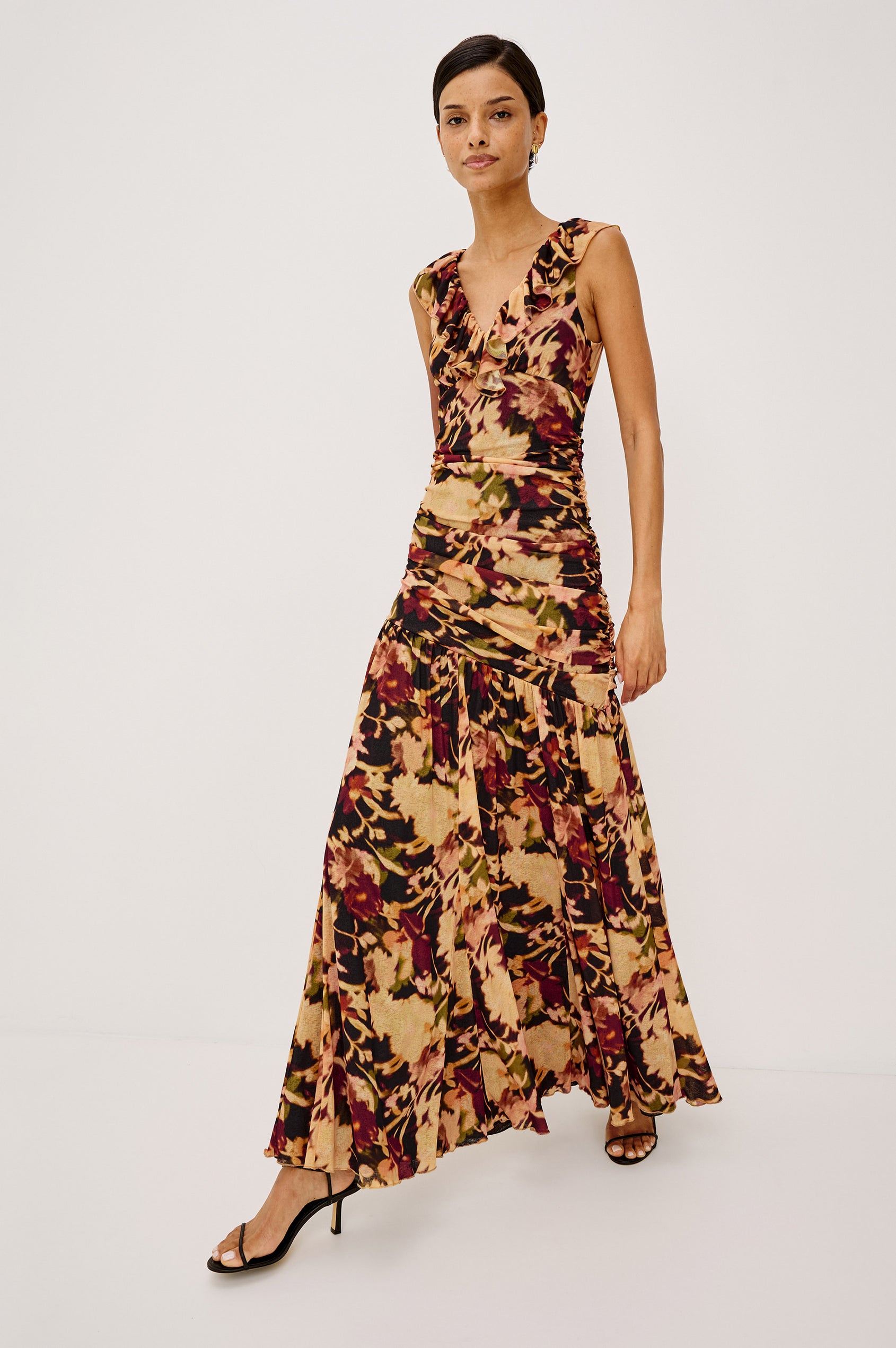 Veda Maxi Dress in Self-Lined Mesh With Sleeveless Cut, Full Lining, Ruffle V-Neckline, Ruched Bodice, and A-Line Skirt in Dark Flora Colorway - Full Body Front View Featured on Model