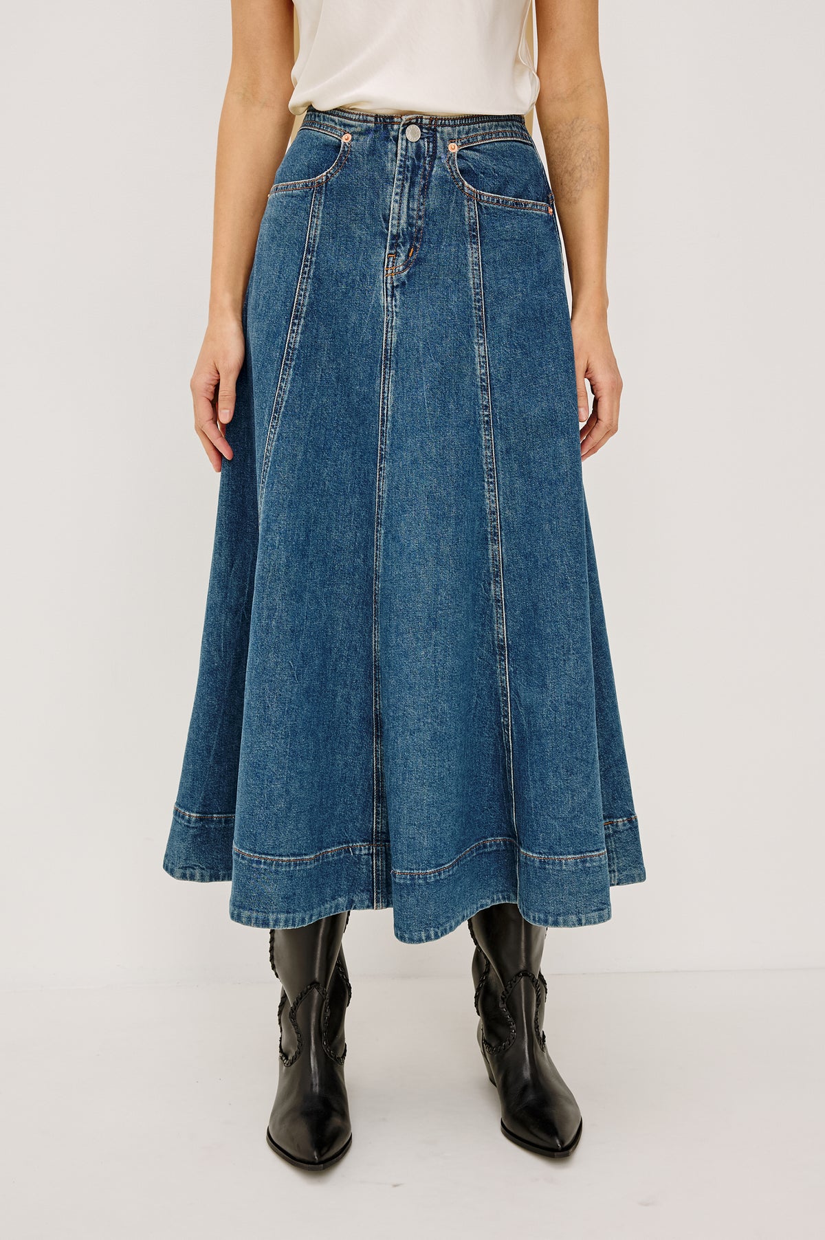 Vicente Midi Skirt in Comfort-Stretch Denim With High-Waisted Fit, Back Yoke, Side Pockets, No Waistband in Meadowbrook Colorway - Front View Featured on Model.