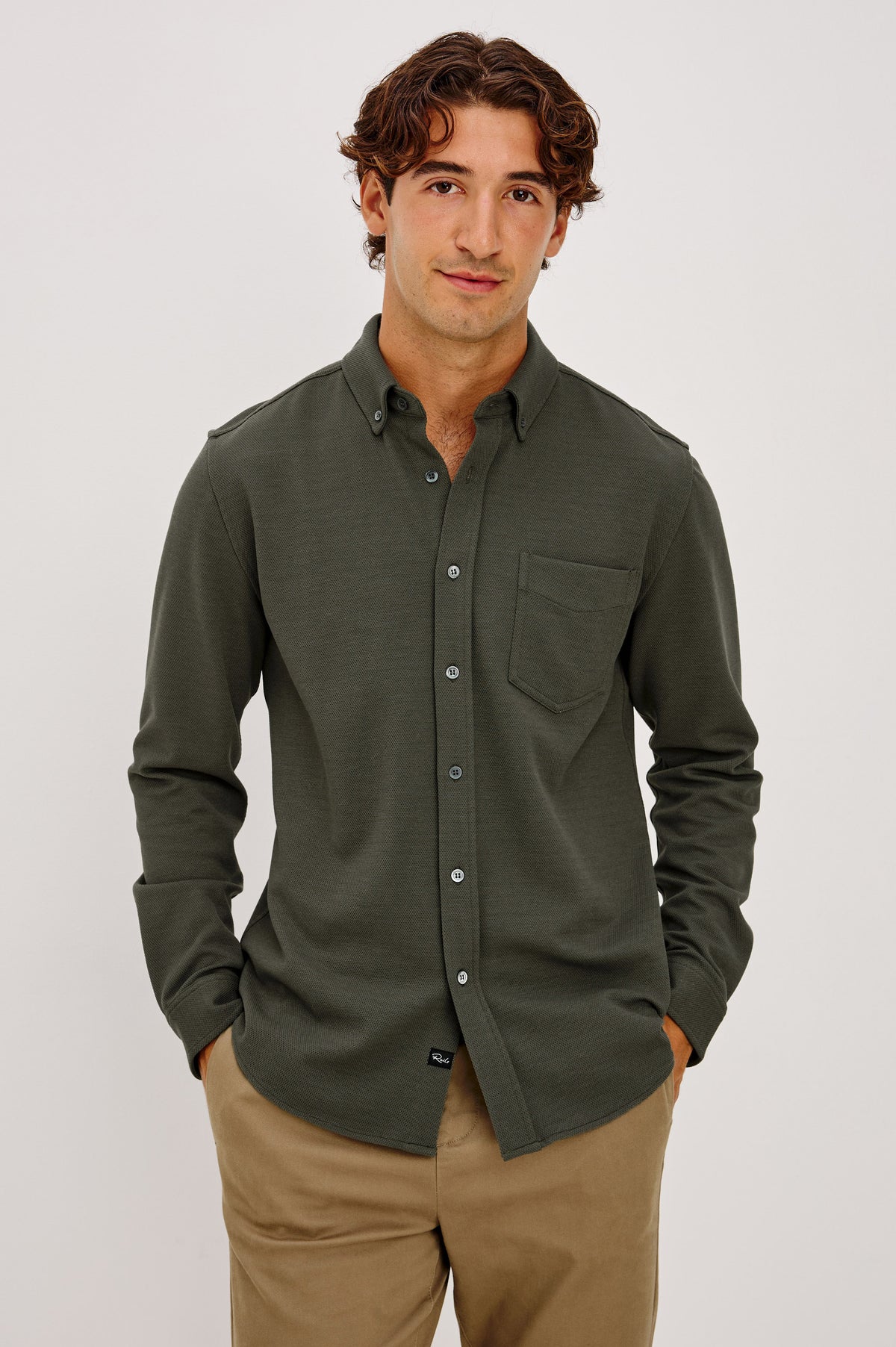 Vincent is a Collared Long Sleeve Button Front Shirt with a Chest Pocket in Hunter Green Colorway - Upper Body Front View Featured on Model.