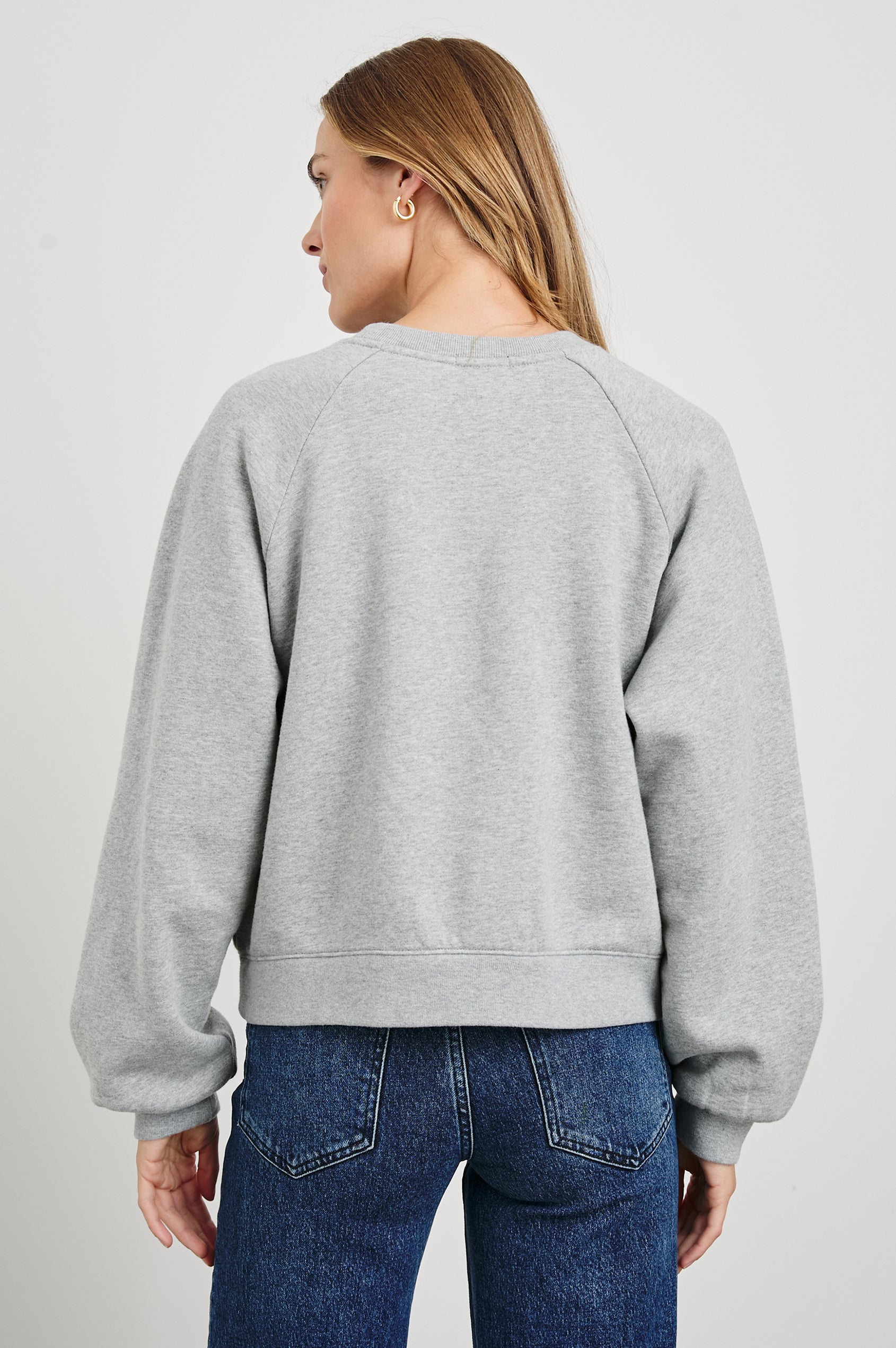 Vintage Raglan Long-Sleeve Sweatshirt with a Crew Neck, an image of landmarks in Los Angeles and the Text, Rails Los Angeles in Rails Los Angeles Map Grey Colorway, Mostly Pink, Yellow and Blue on Grey - Back View Featured on Model