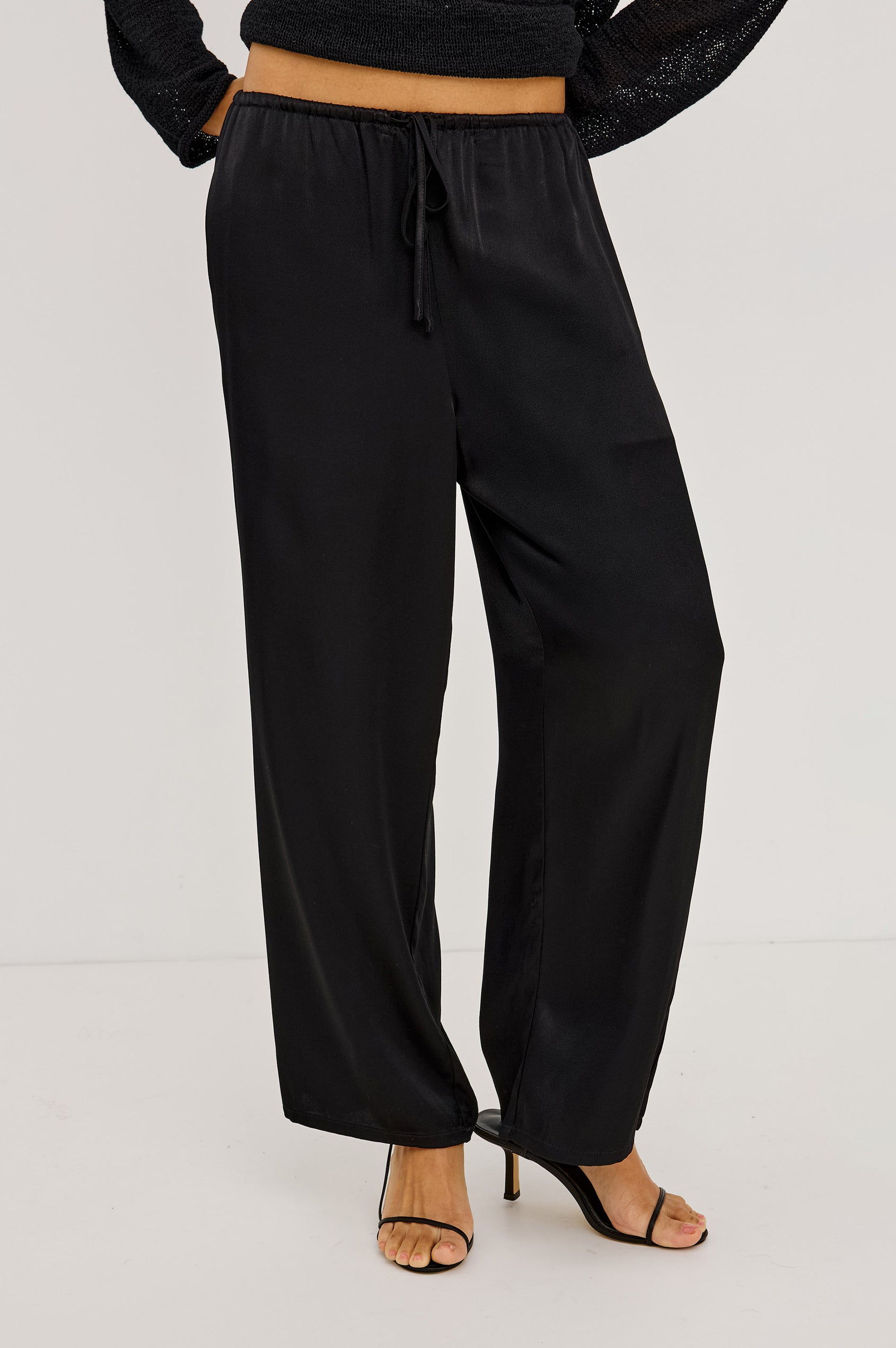 Virgo Pant in Satin-Back Crepe With Srtaight Legs, Drawstring Waist, and Side-Seam Pockets in Black Colorway - Lower Body Front View Featured on Model