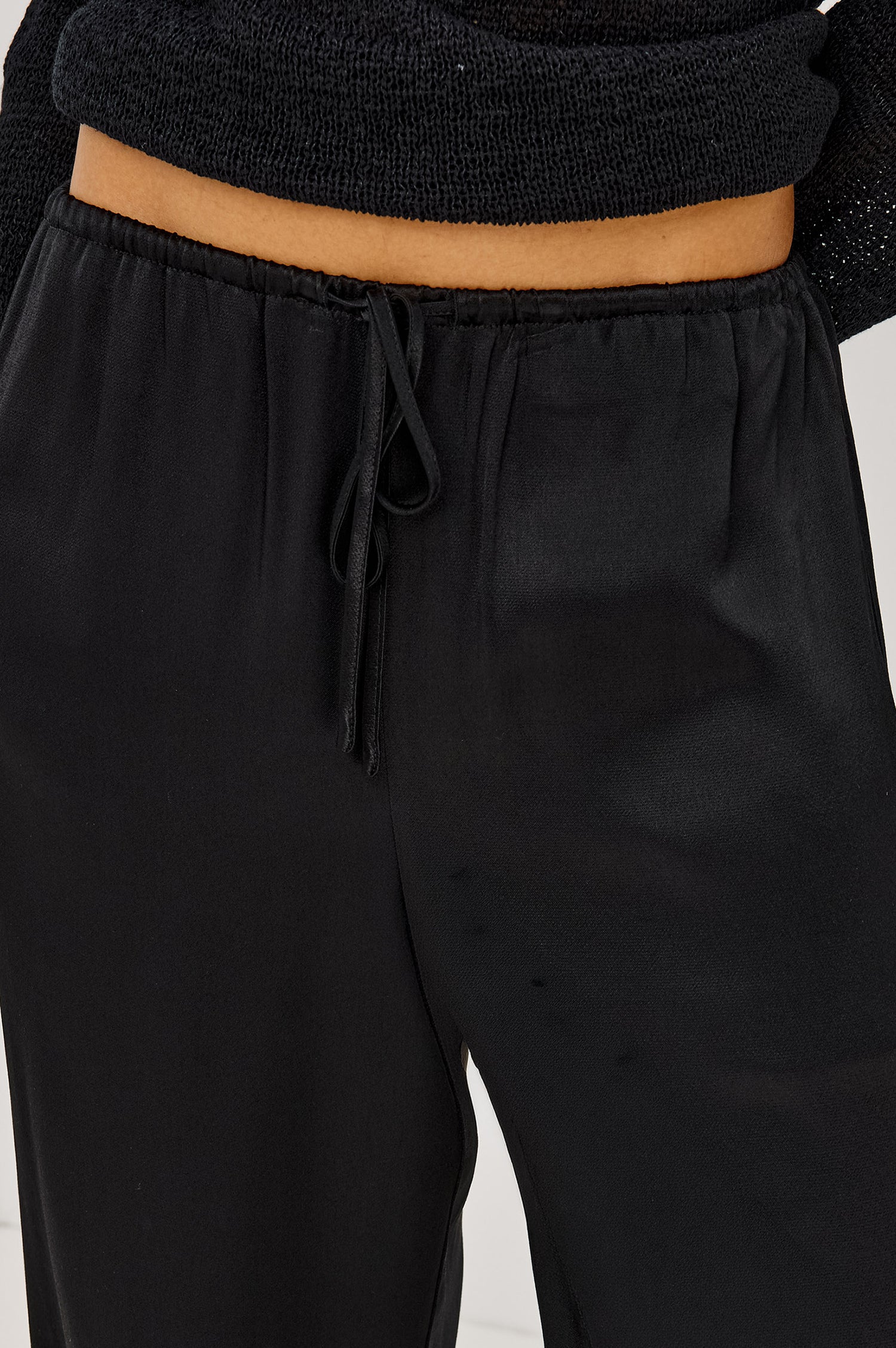 Virgo Pant in Satin-Back Crepe With Srtaight Legs, Drawstring Waist, and Side-Seam Pockets in Black Colorway - Lower Body Front View Featured on Model