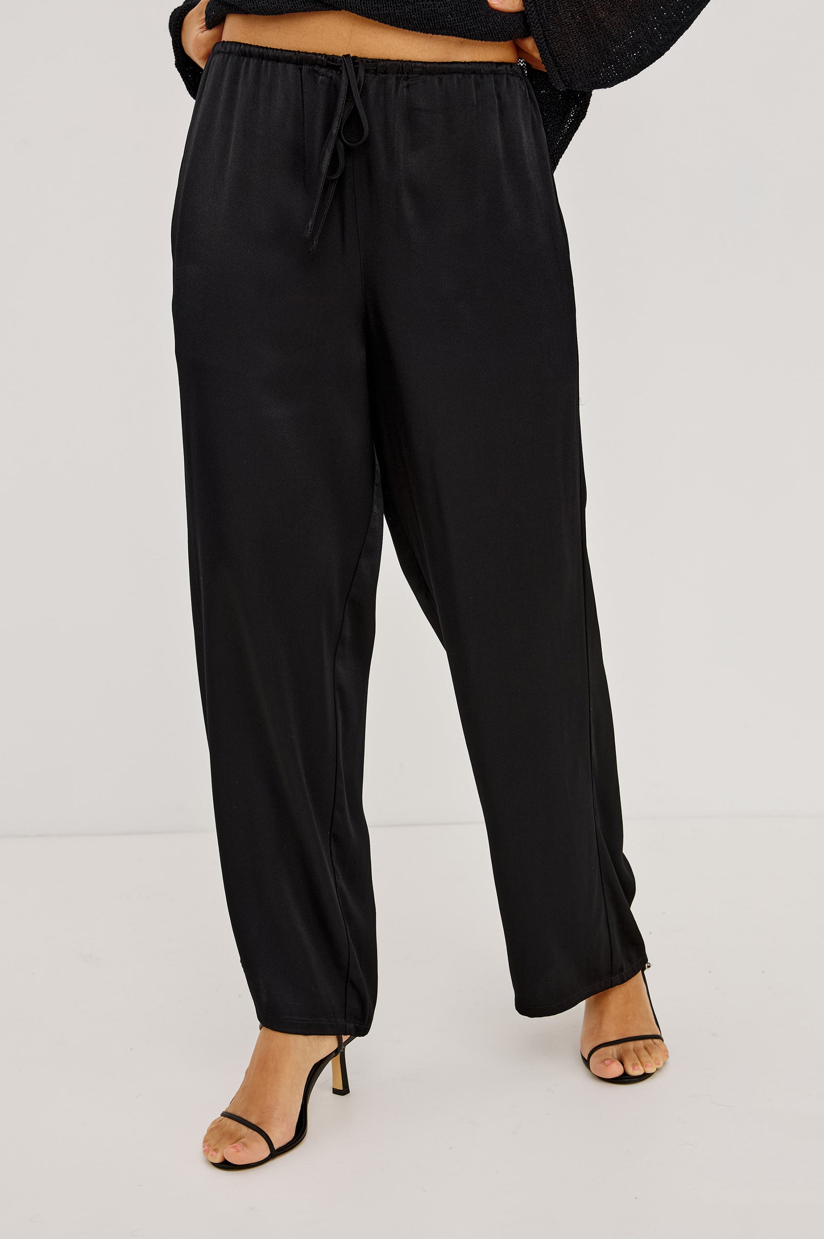 Virgo Pant in Satin-Back Crepe With Srtaight Legs, Drawstring Waist, and Side-Seam Pockets in Black Colorway - Lower Body Front View Featured on Model