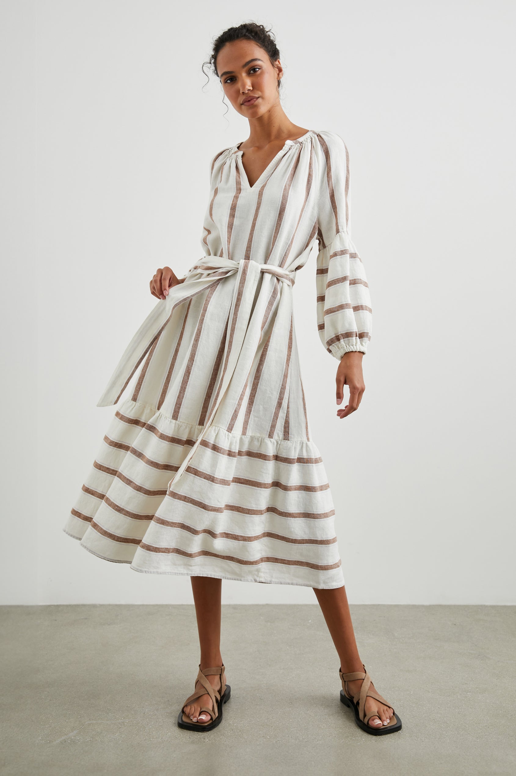 Vittoria Midi Dress with Three-Quarter Sleeves, a V Neck, Light Ruching at the Collar, and a Fabric Tie Belt in Coconut Stripe Colorway, Coconut Vertical Stripes on White with Horizontal Stripes at the Hem - Front Full Body View Featured on Model