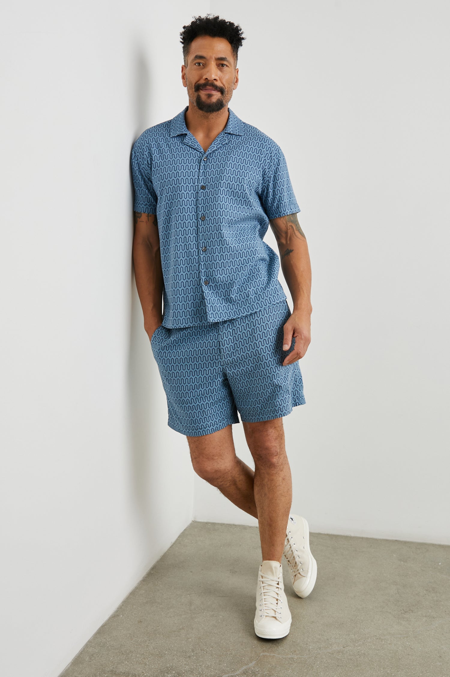 Waimea Short-Sleeve Button Up with a Chest Patch Pocket in Wishbone Blues Colorway, a dark and light blue geometric pattern - Front Full Body View Featured on Model