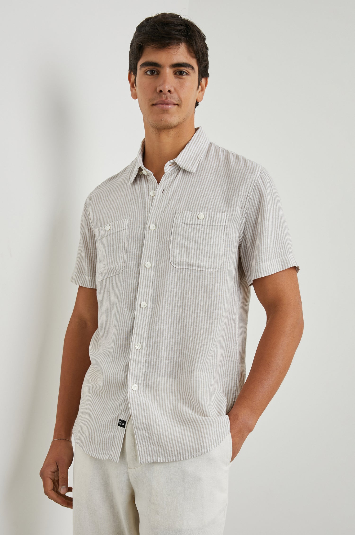 Walker Short-Sleeve Button Up with Two Chest Button Patch Pockets in Ghurka White Railroad Colorway, White and Grey Vertical Stripes - Front View Featured on Model