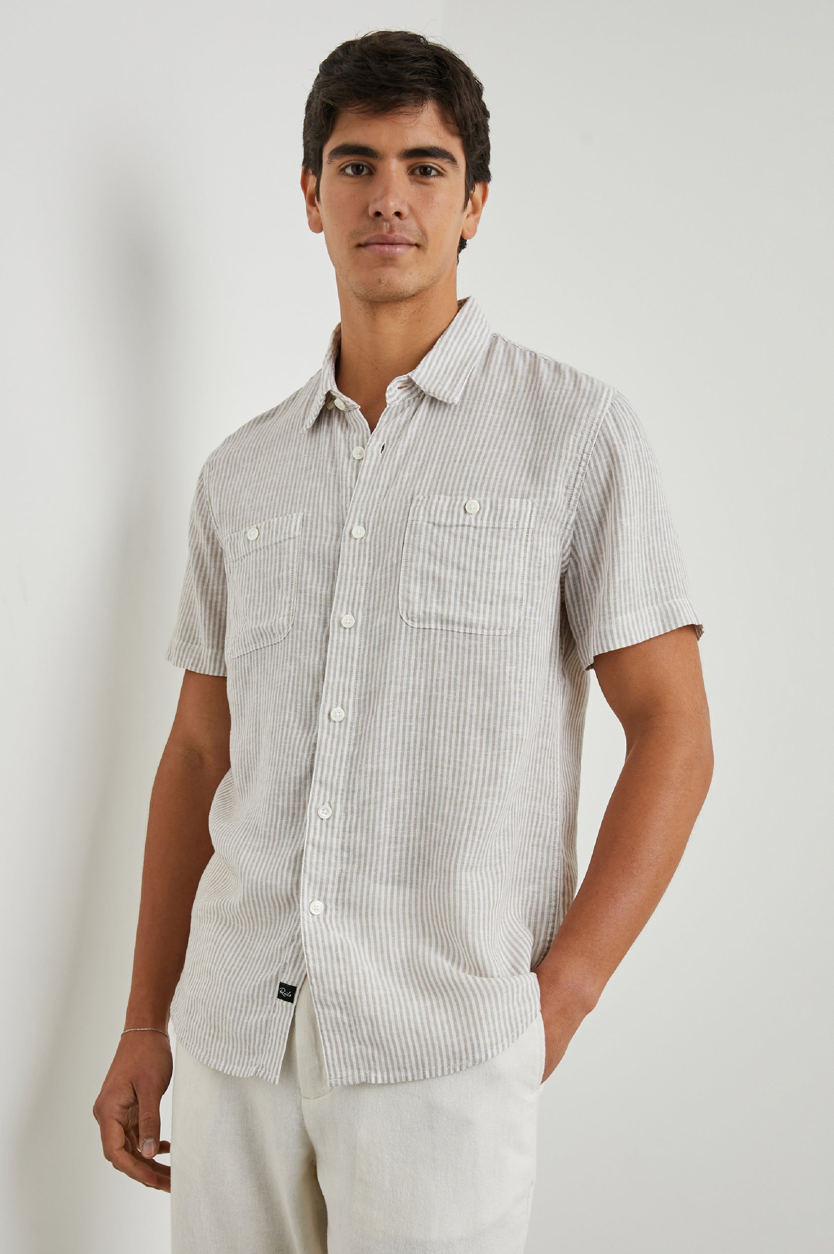 Walker Short-Sleeve Button Up with Two Chest Button Patch Pockets in Ghurka White Railroad Colorway, White and Grey Vertical Stripes - Front View Featured on Model
