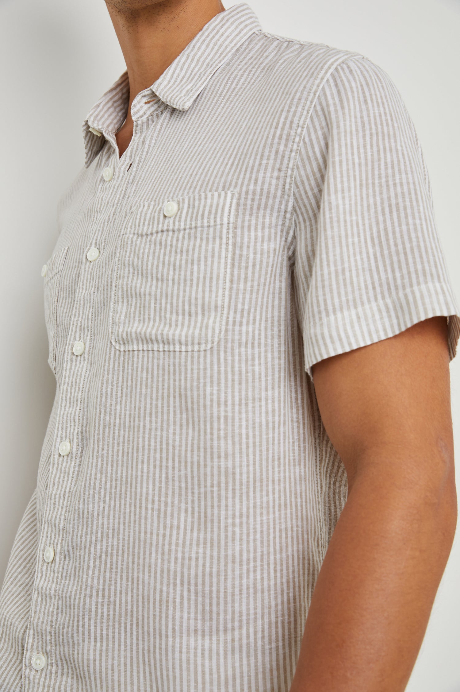 Walker Short-Sleeve Button Up with Two Chest Button Patch Pockets in Ghurka White Railroad Colorway, White and Grey Vertical Stripes - Front View Featured on Model