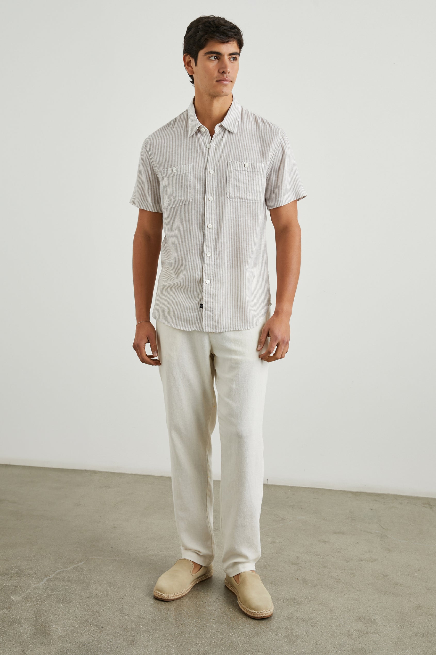Walker Short-Sleeve Button Up with Two Chest Button Patch Pockets in Ghurka White Railroad Colorway, White and Grey Vertical Stripes - Front Full Body View Featured on Model
