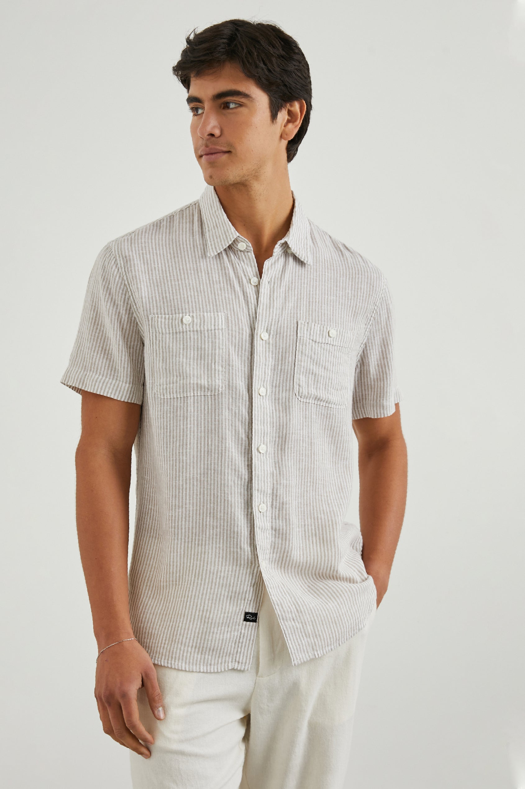 Walker Short-Sleeve Button Up with Two Chest Button Patch Pockets in Ghurka White Railroad Colorway, White and Grey Vertical Stripes - Front View Featured on Model
