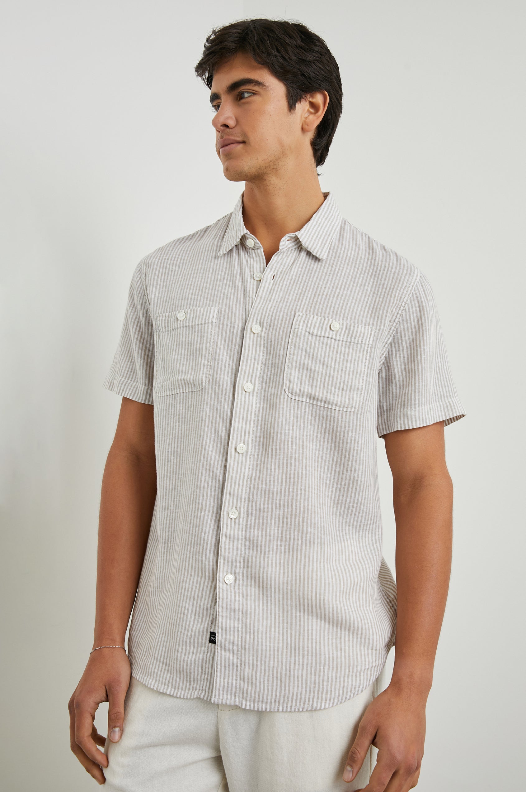 Walker Short-Sleeve Button Up with Two Chest Button Patch Pockets in Ghurka White Railroad Colorway, White and Grey Vertical Stripes - Front View Featured on Model