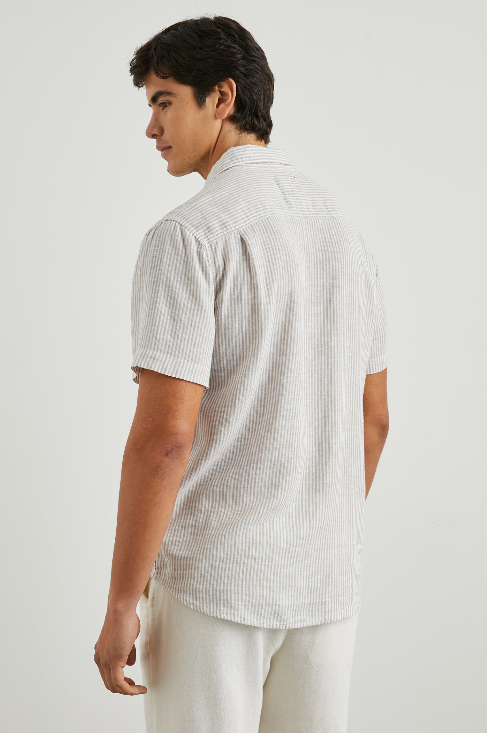 Walker Short-Sleeve Button Up with Two Chest Button Patch Pockets in Ghurka White Railroad Colorway, White and Grey Vertical Stripes - Back View Featured on Model