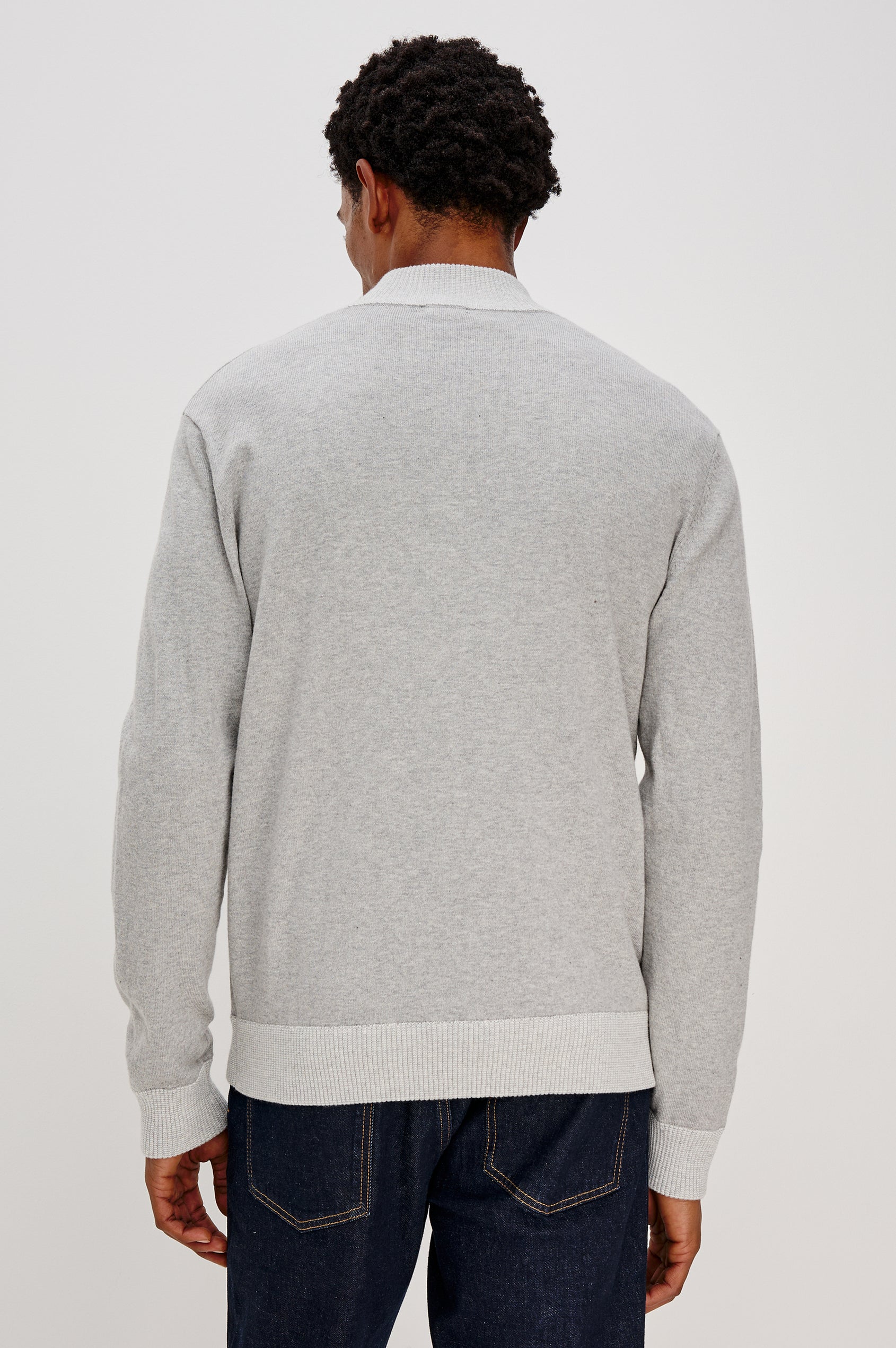 The Waylon is a quarter zip mock neck sweater with long sleeves and rib trim in Grey Heather colorway. Back view featured on model.