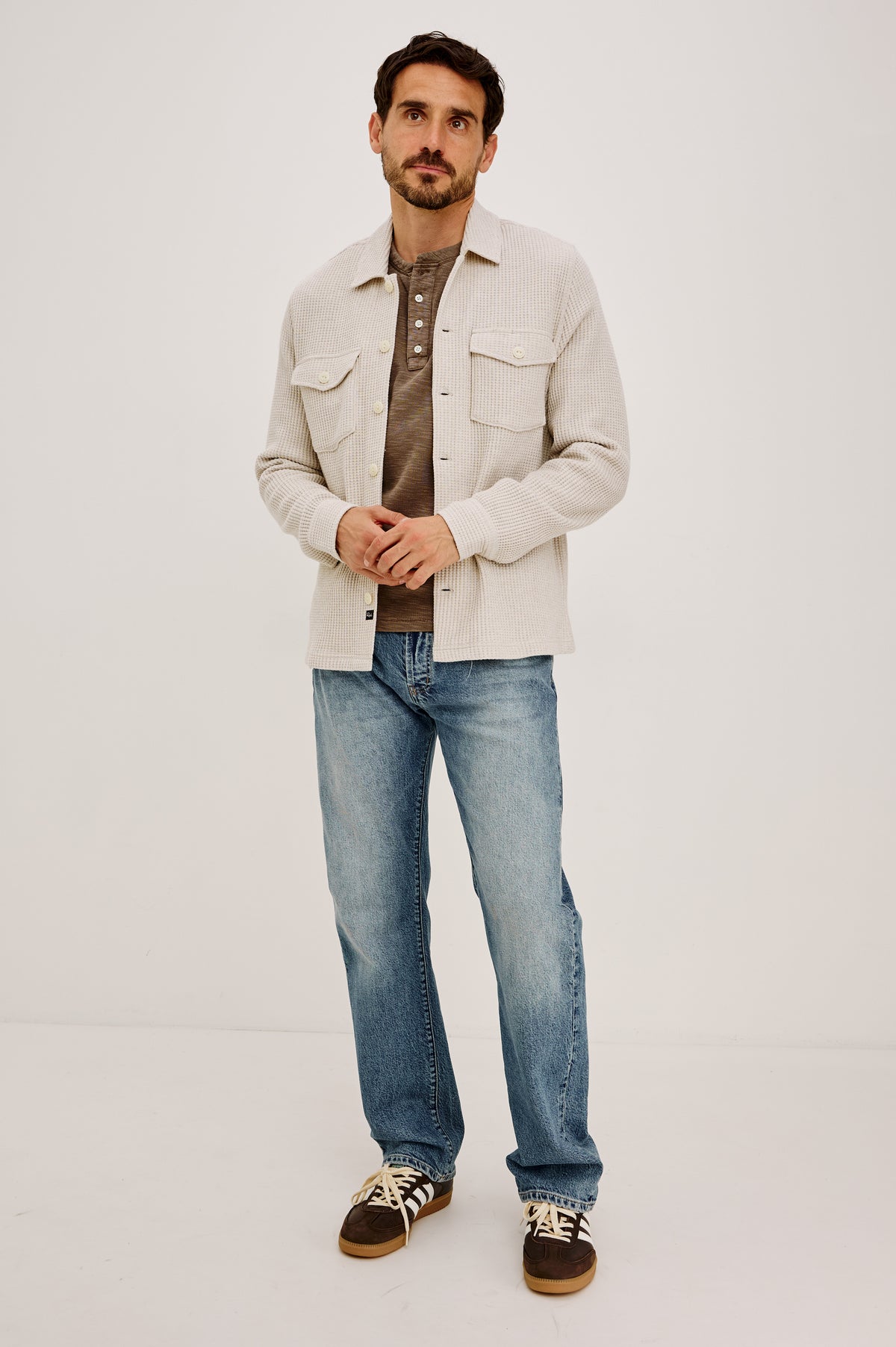 Wells Overshirt in Waffle Knit With Front Buttons, Chest Flap Pockets, Point Collar, and Long Sleeves in Oat Heather Colorway - Full Body Front View Featured on Model.