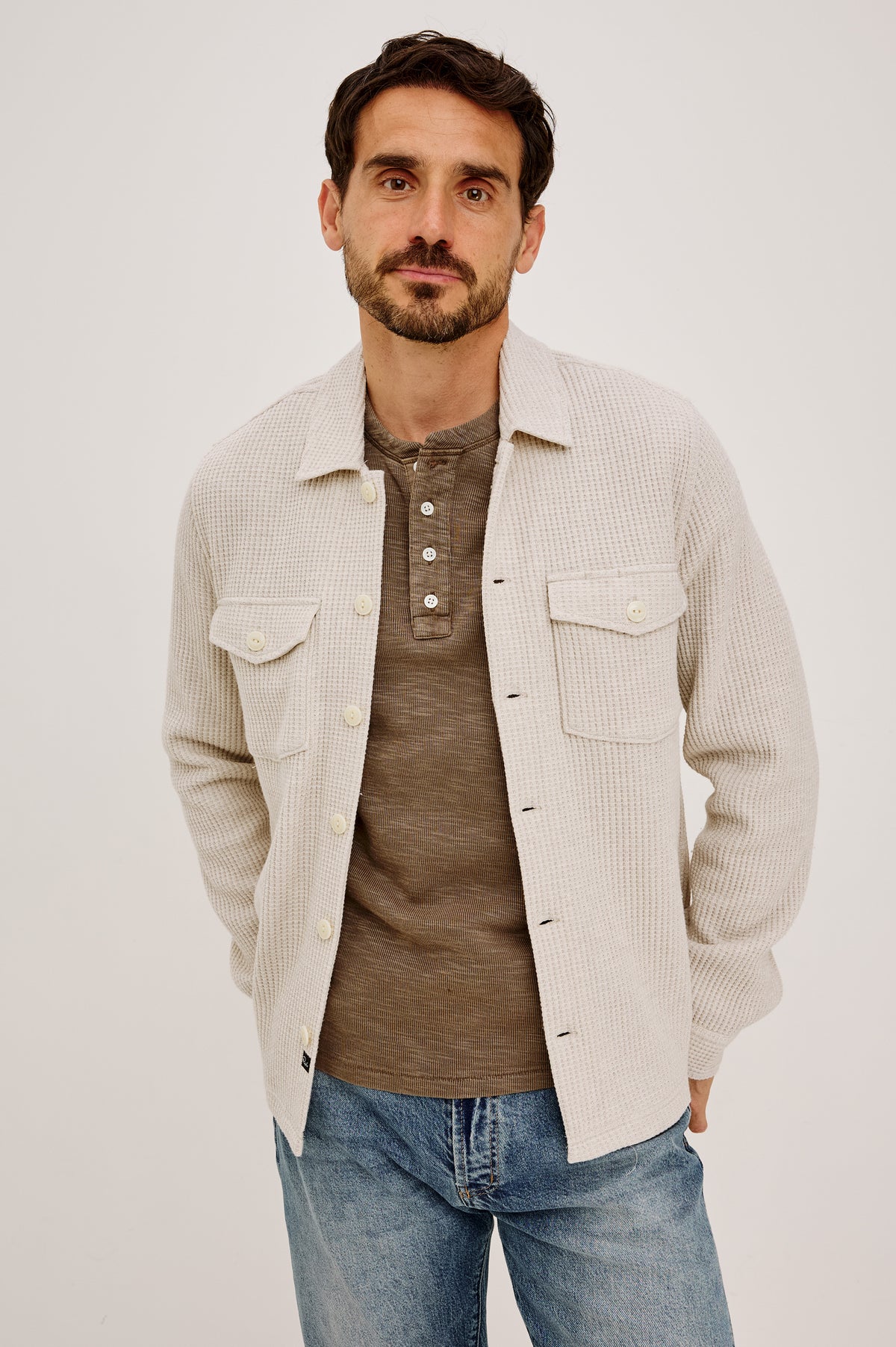 Wells Overshirt in Waffle Knit With Front Buttons, Chest Flap Pockets, Point Collar, and Long Sleeves in Oat Heather Colorway - Front View Featured on Model.