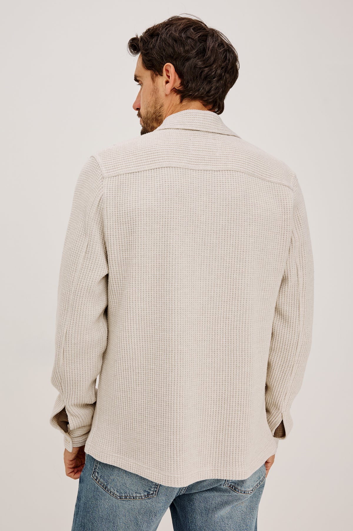 Wells Overshirt in Waffle Knit With Front Buttons, Chest Flap Pockets, Point Collar, and Long Sleeves in Oat Heather Colorway - Upper Body Back View Featured on Model.