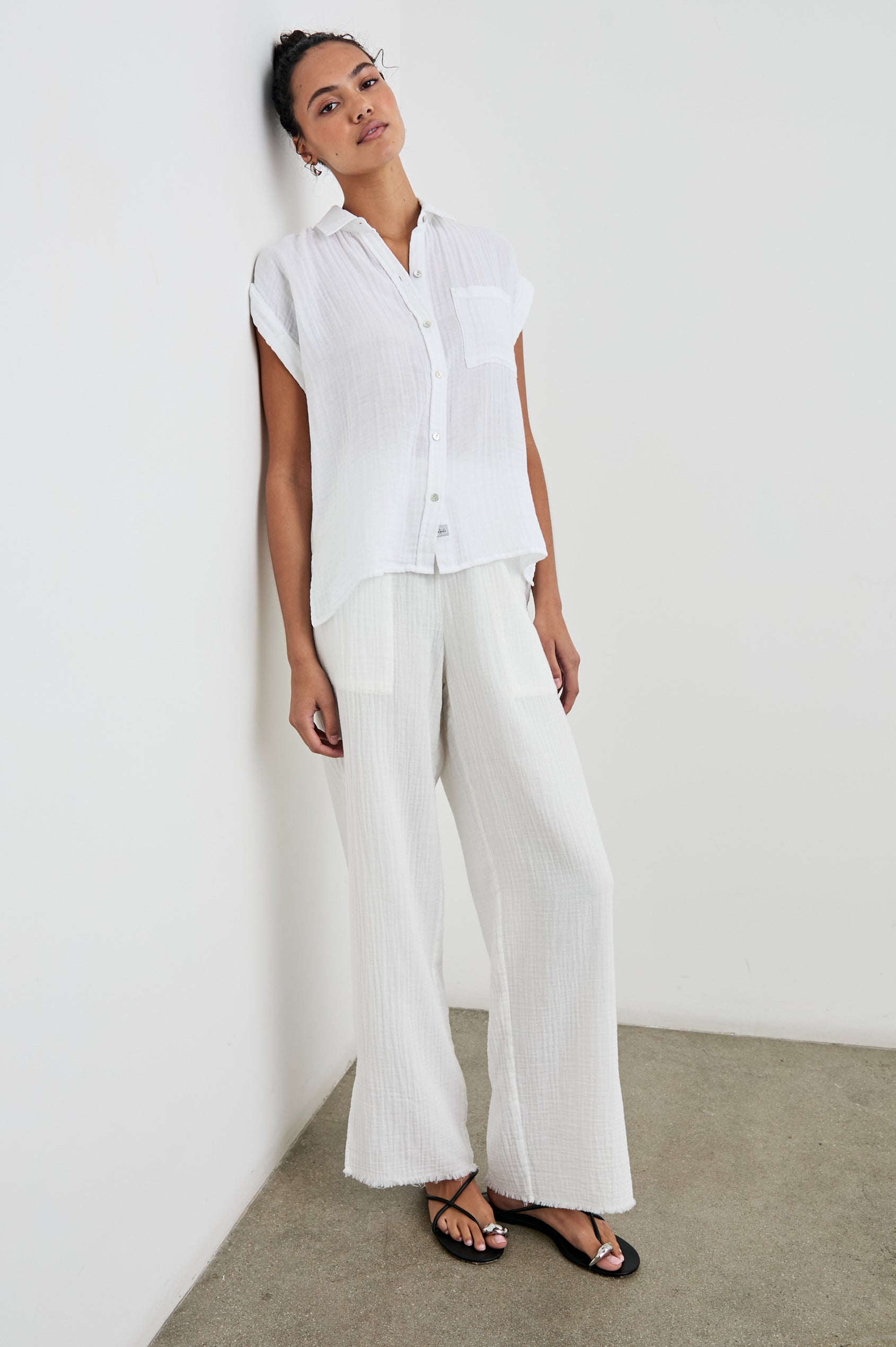 Whitney Short Rolled Sleeves Button Up with a Chest Patch Pocket and Short Side Slits in White Colorway - Front Full Body View Featured on Model