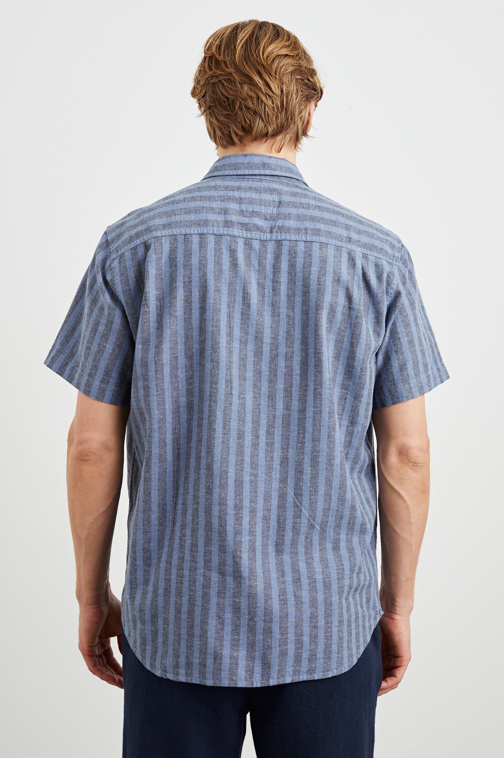  Wilder Short Sleeve Button Up Shirt with Chest Patch Pocket in Marine Sapphire Stripe Colorway, Grey and Blue Vertical Stripes - Back View Featured on Model