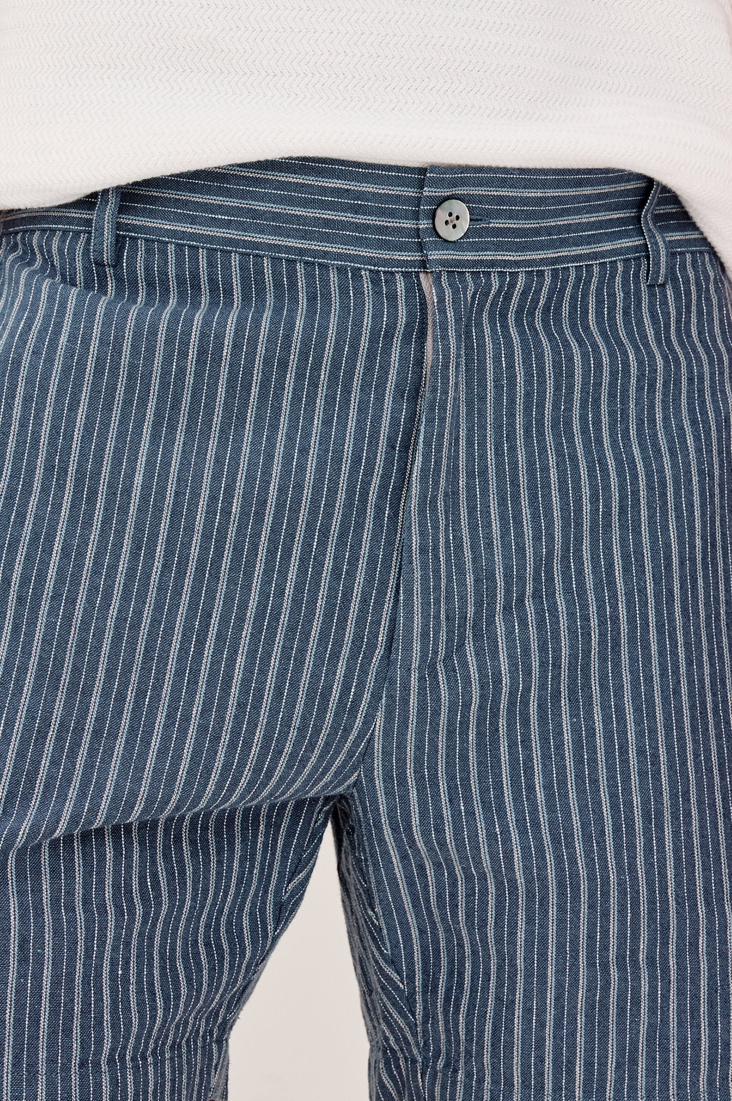 Wilson Short in Linen With a Straight Fit, Clean Front Waistband, Elasticated Back, Front Zip Fly, and Side Pockets in Navy Multi Stripe Colorway - Lower Body Front View Featured on Model