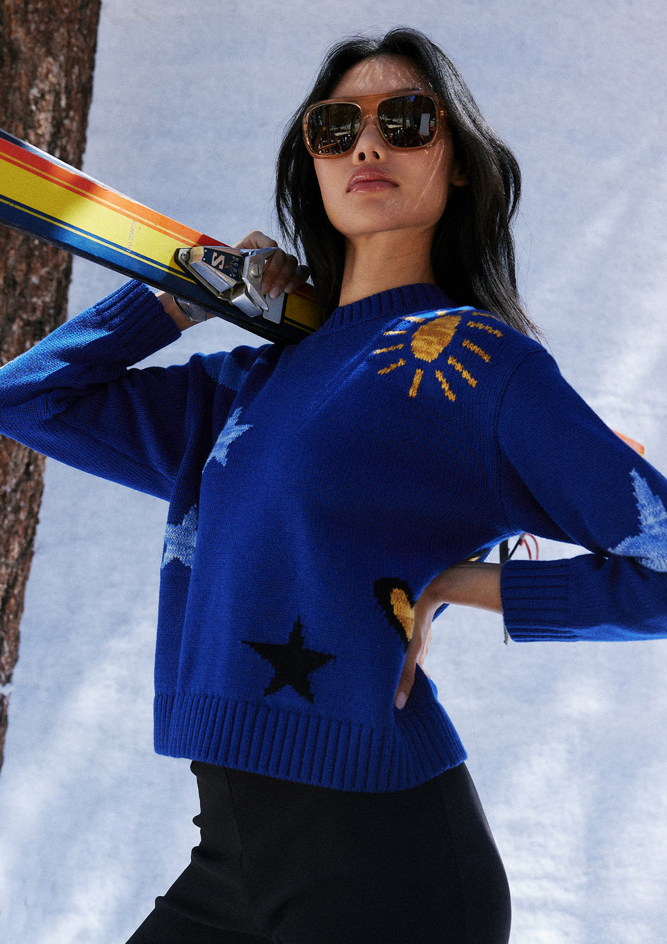 SIDE EDITORIAL IMAGE OF MODEL WEARING ZOEY SWEATER IN COBALT GOLD GALAXY
