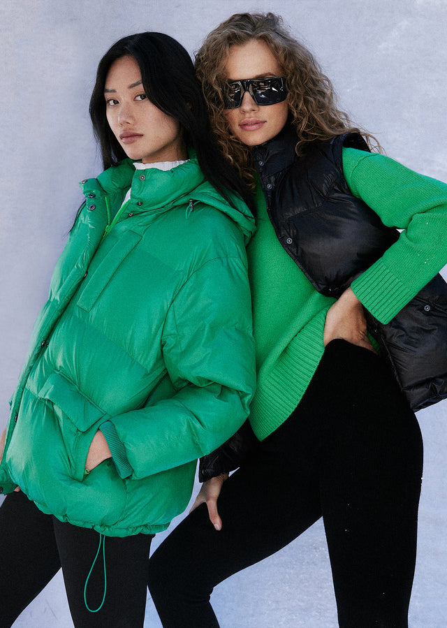 EDITORIAL IMAGE OF TWO MODELS. FIRST MODEL IS WEARING PACEY JACKET IN SHAMROCK. SECOND MODEL IS WEARING PRESTON VEST IN BLACK.